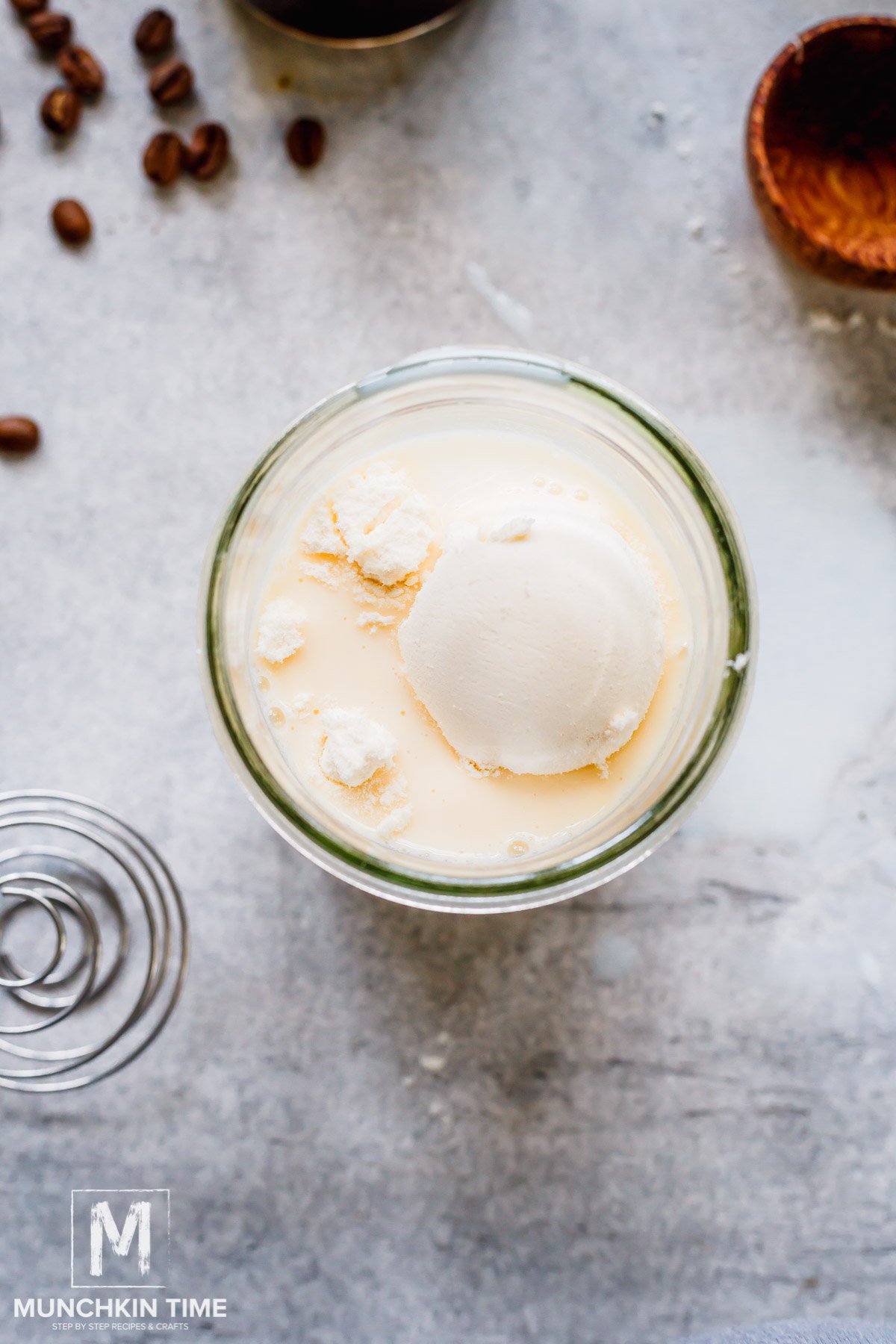 milk and protein powder inside mason jar.