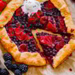 Freshly baked strawberry galette made with sourdough discard sliced with ice cream on top.