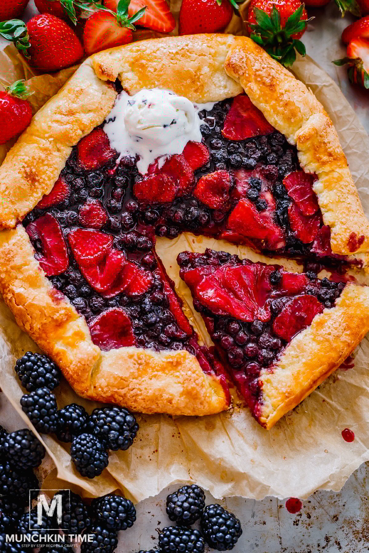 Freshly baked strawberry galette made with sourdough discard sliced with ice cream on top.