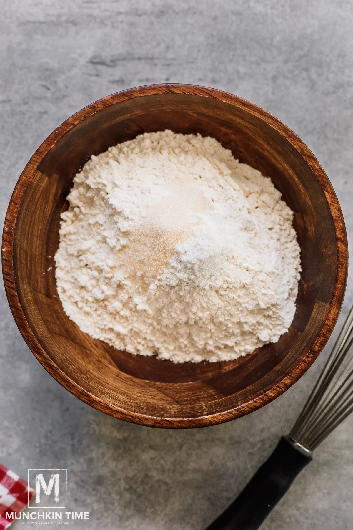 a bowl with flour salt and sugar.