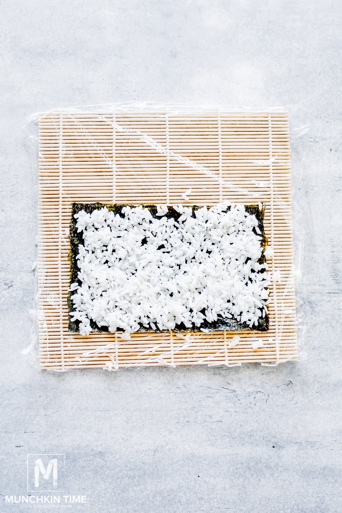 Sushi rice spread over the nori sheet.