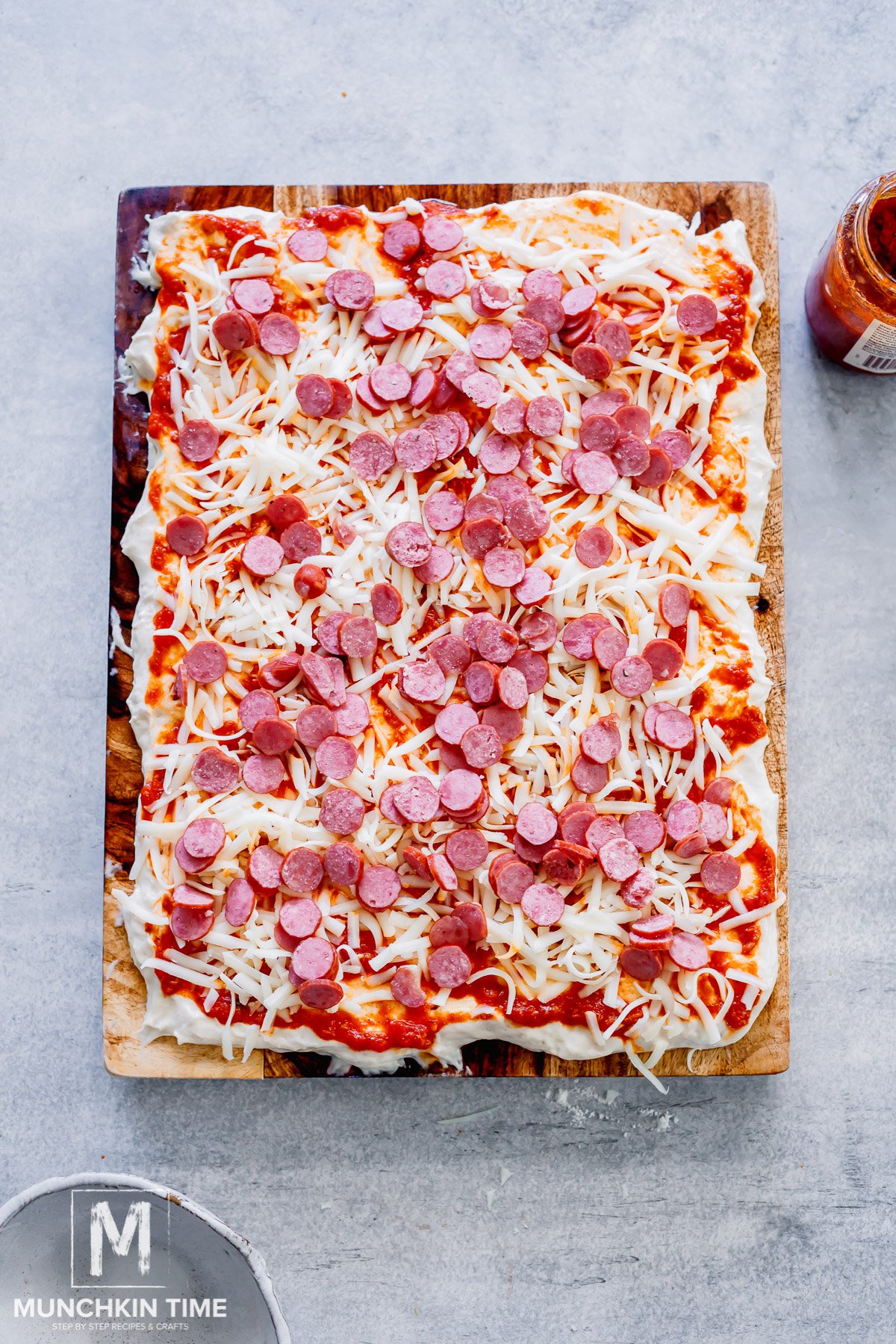 salami added to the pizza before baking.