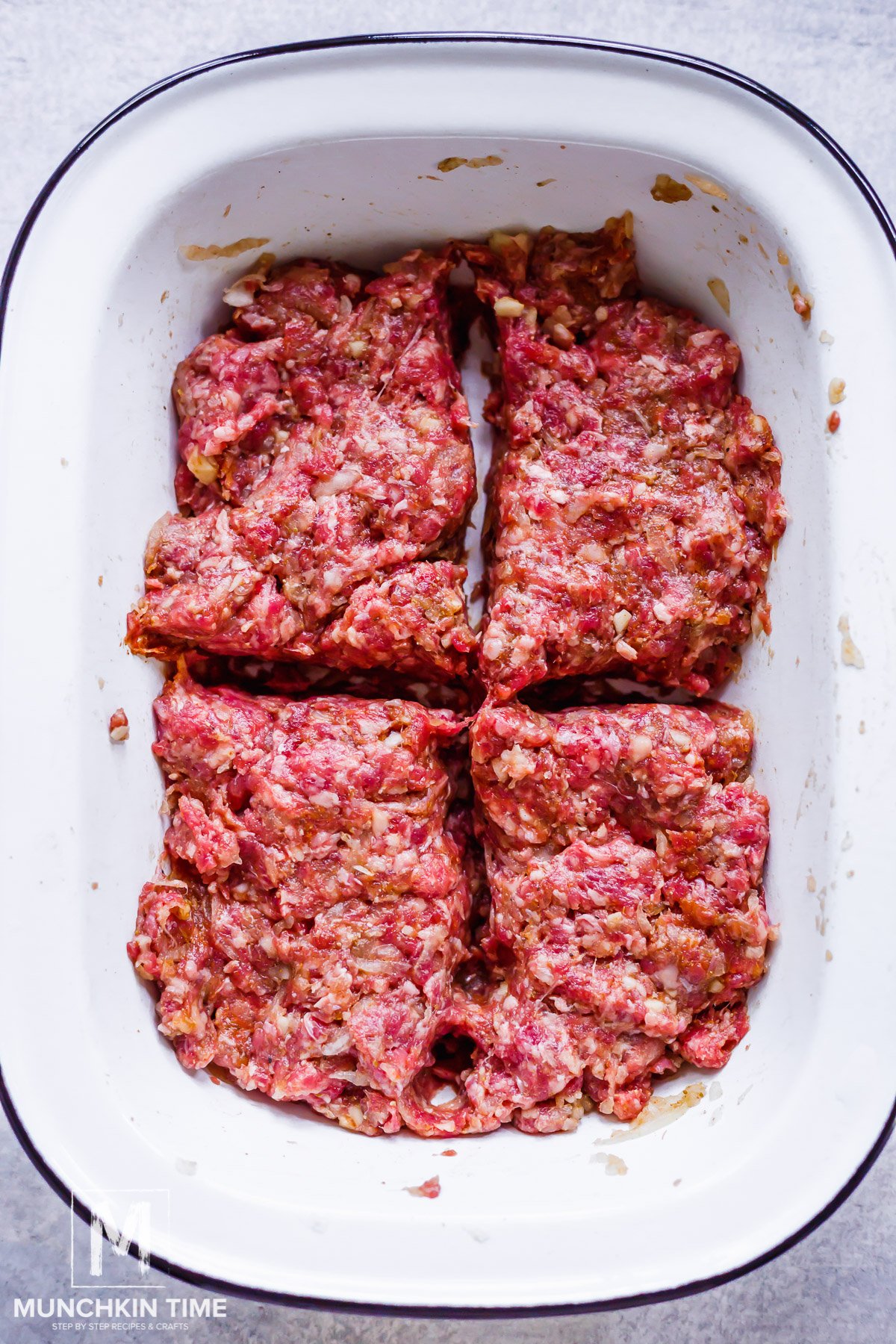 Meat mixture divided into 4 equal parts.