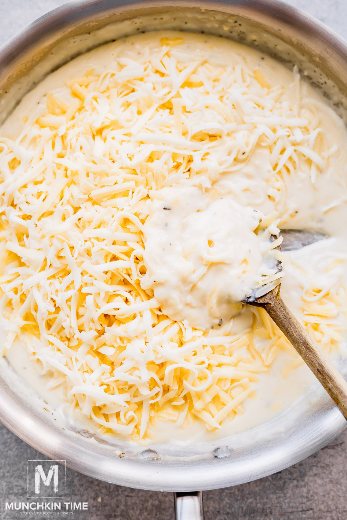Grated cheese added to the skillet with the creamy sauce.