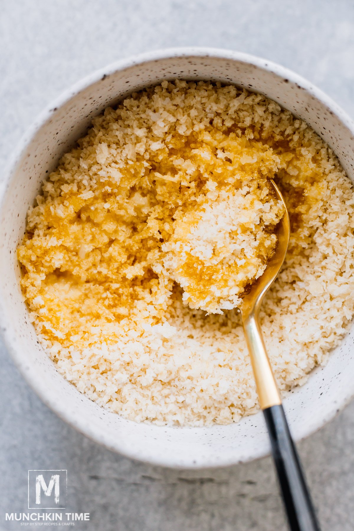 breadcrumbs and melted butter in a bowl.