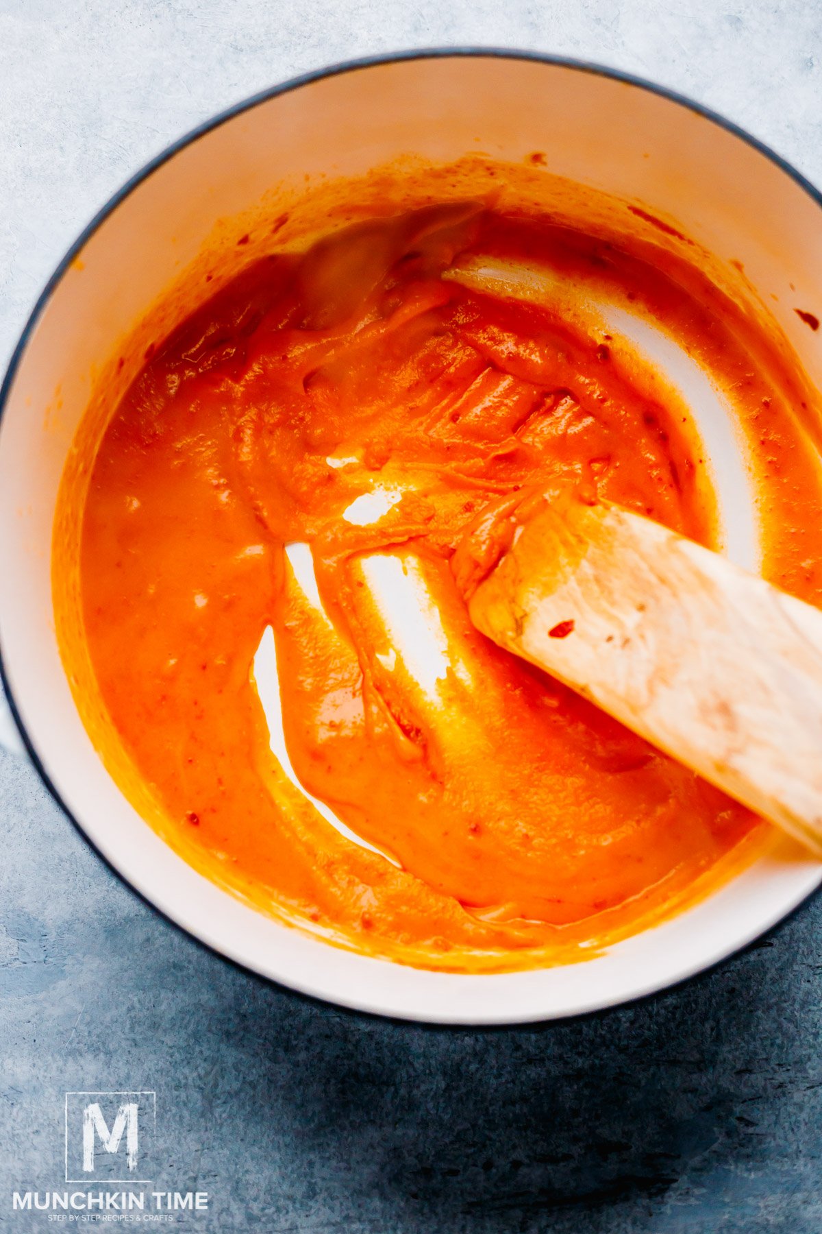 Chicken broth mixed into the flour and tomato paste mixture.