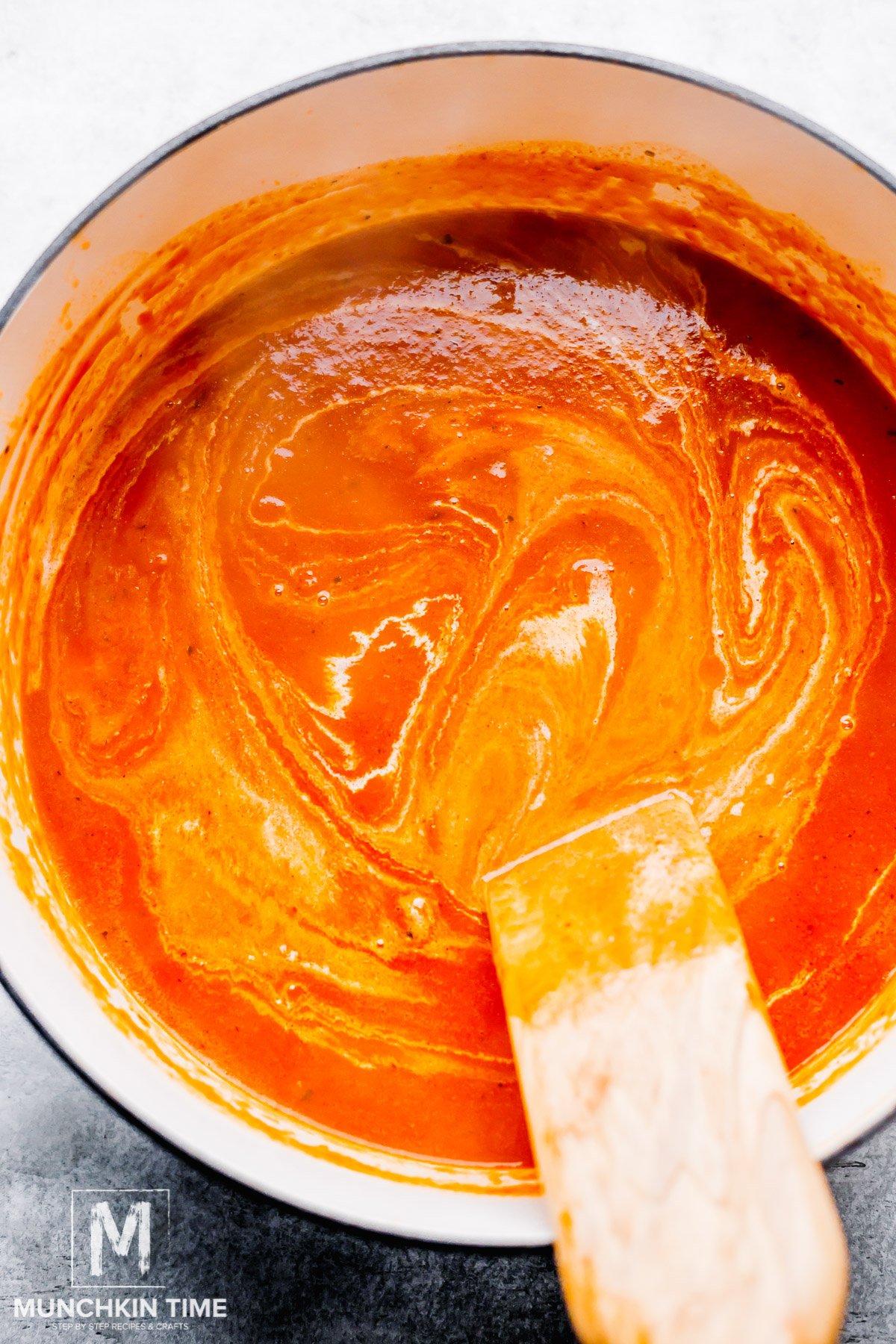 Tomato Bisque almost done cooking in a dutch oven pot.