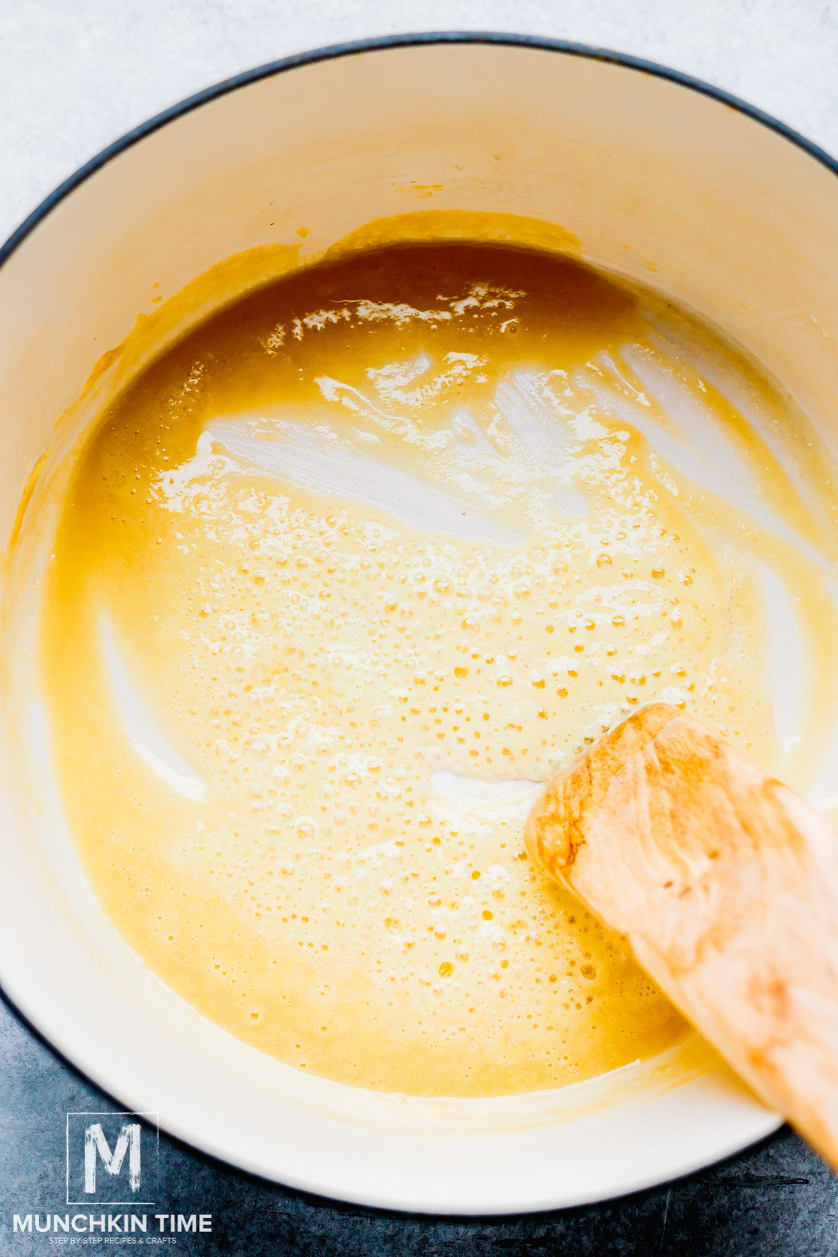 cooked flour with butter in a pot with a wooden spoon.