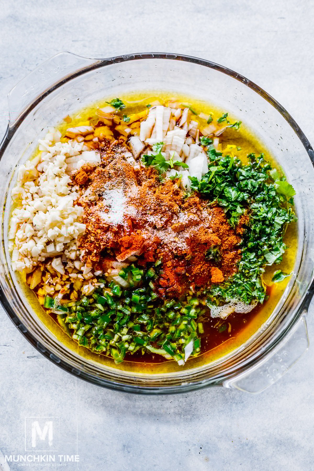 All carne asada marinade ingredients added to the bowl.