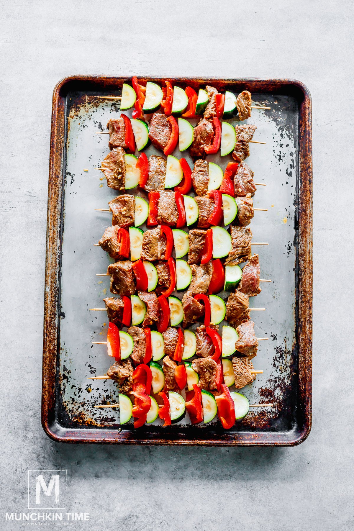meat skewered onto a wooden skewers.