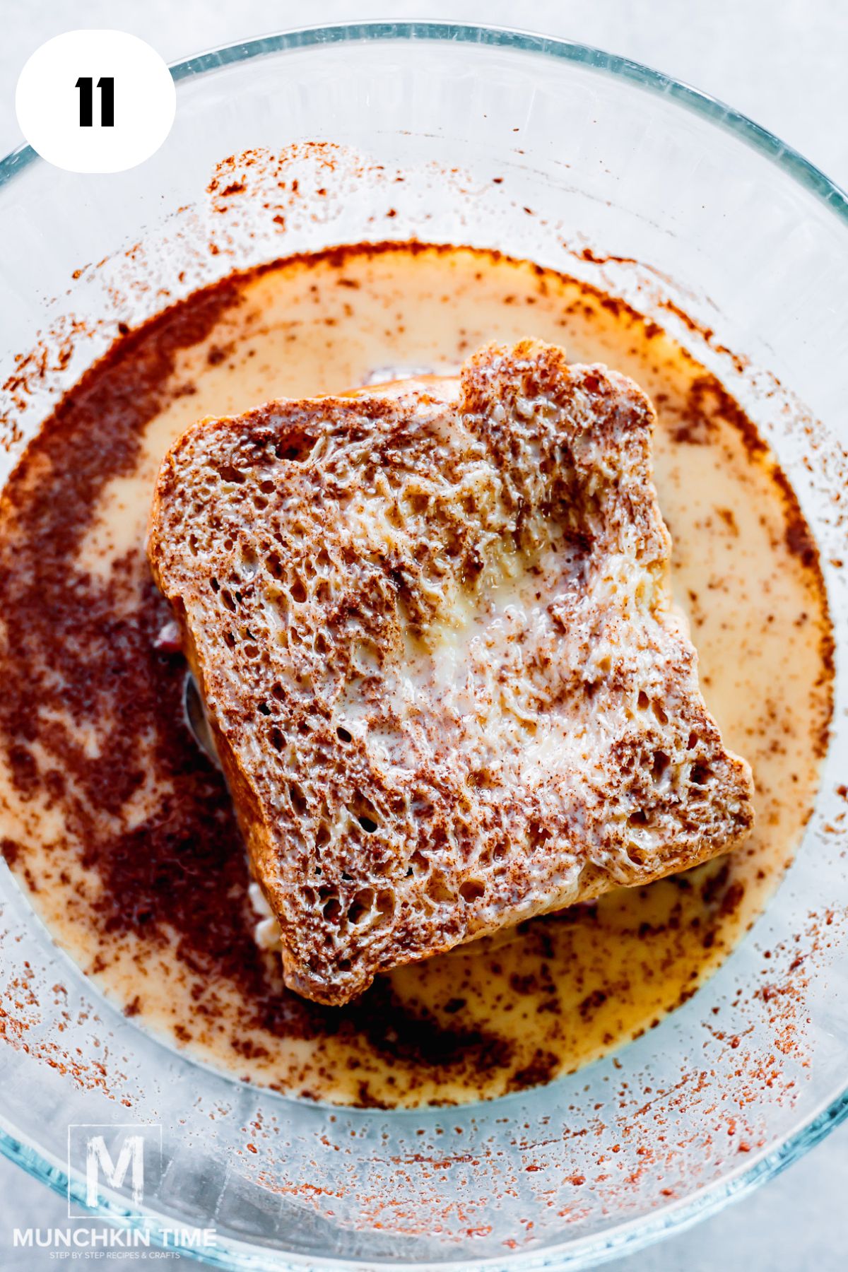 sandwich in milk cinnamon mixture flipped on to the other side.
