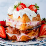 Strawberry Stuffed French Toast with cream cheese with sliced strawberries on the top.