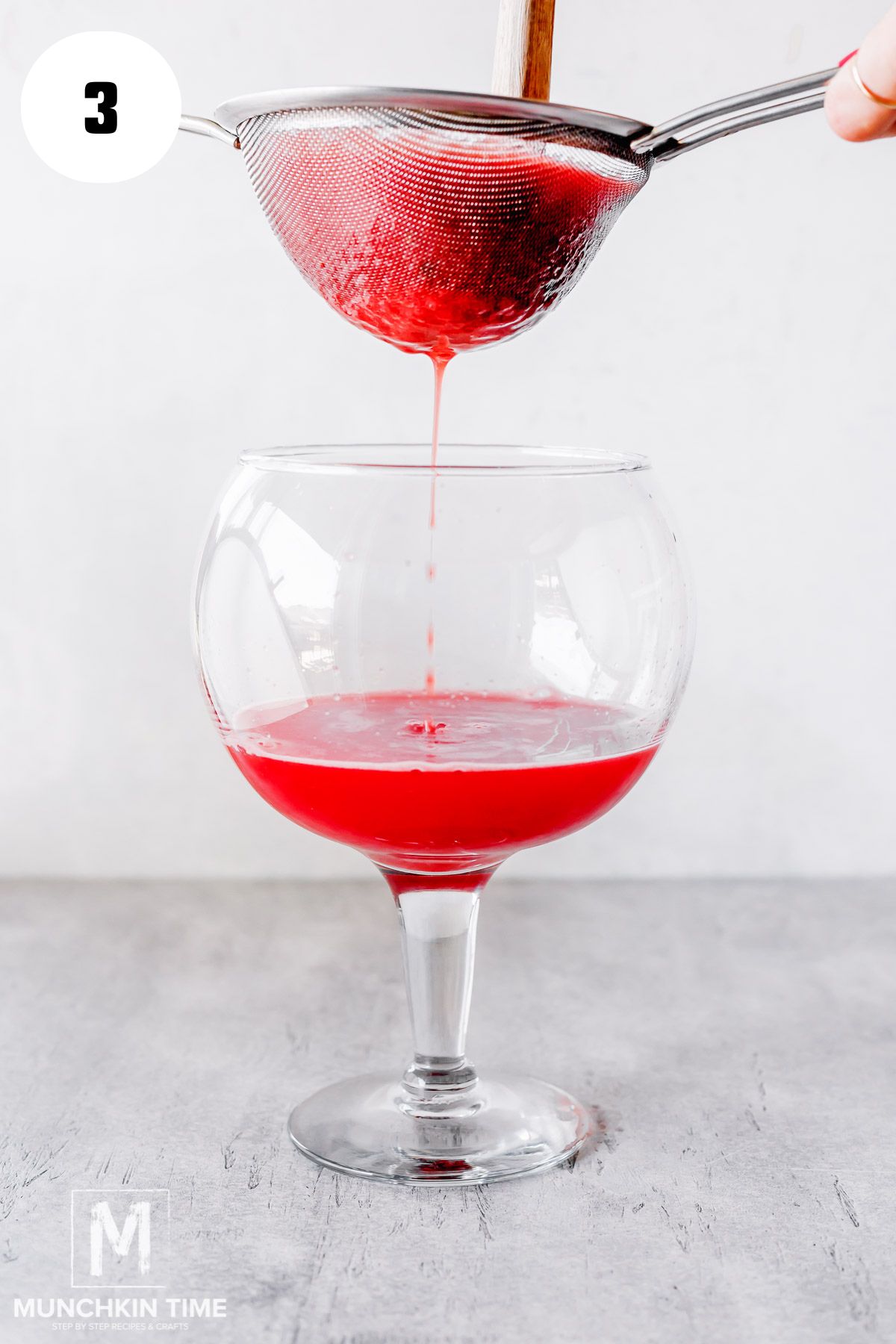 watermelon juice strained into a glass.