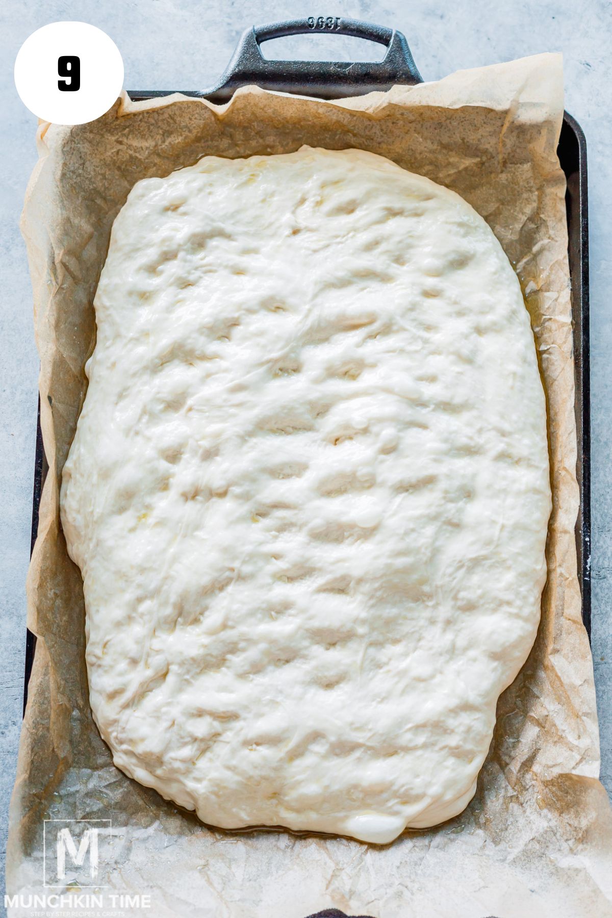 Same Day Sourdough Focaccia dough on a baking sheet.