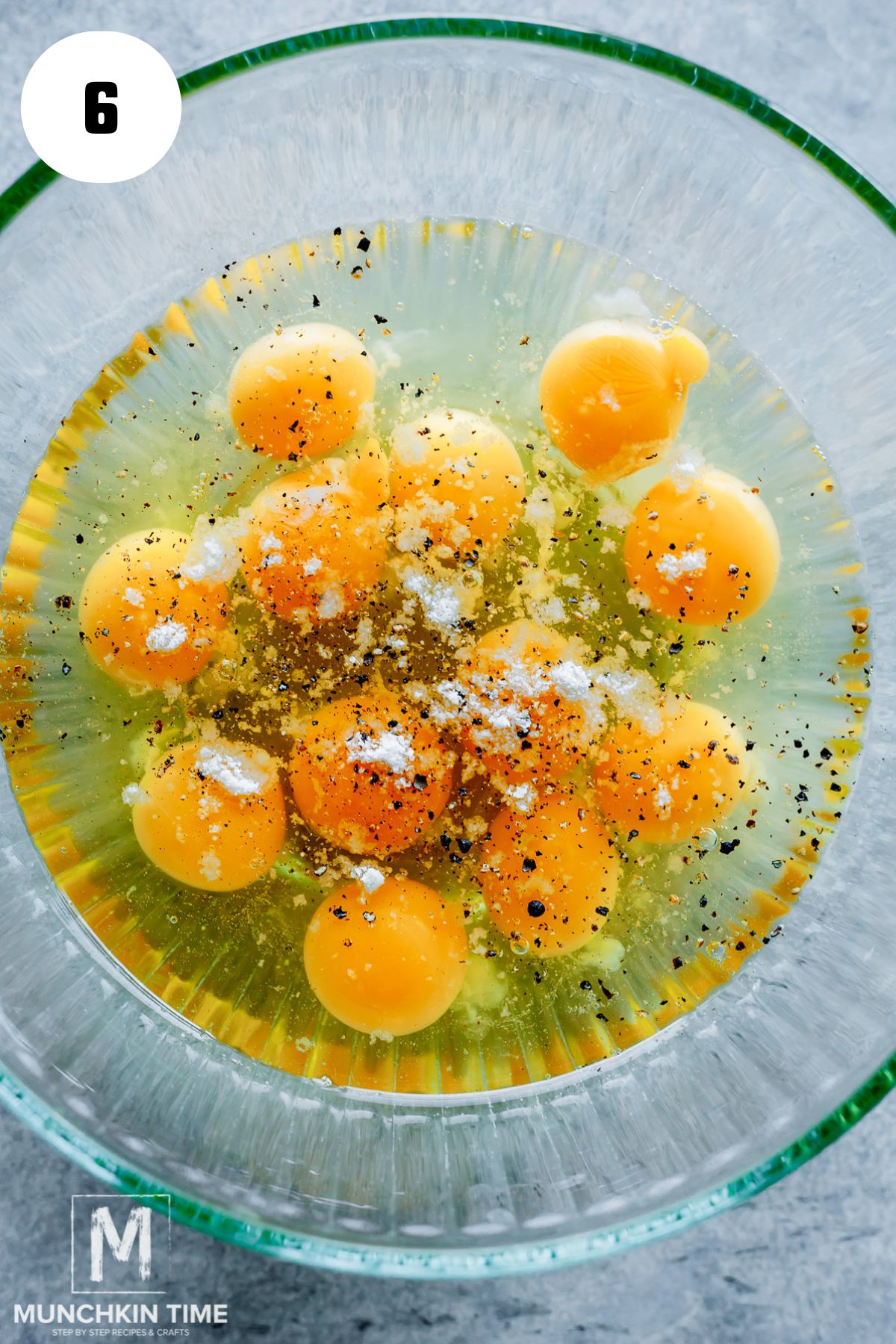 raw eggs seasoned with salt and pepper.