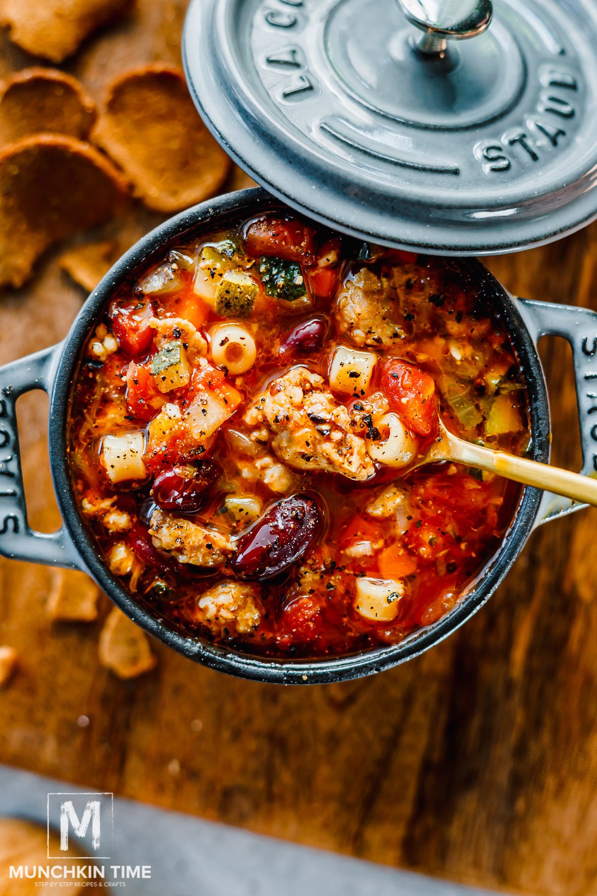 Italian sausage soup done cooking served in a mini pot.