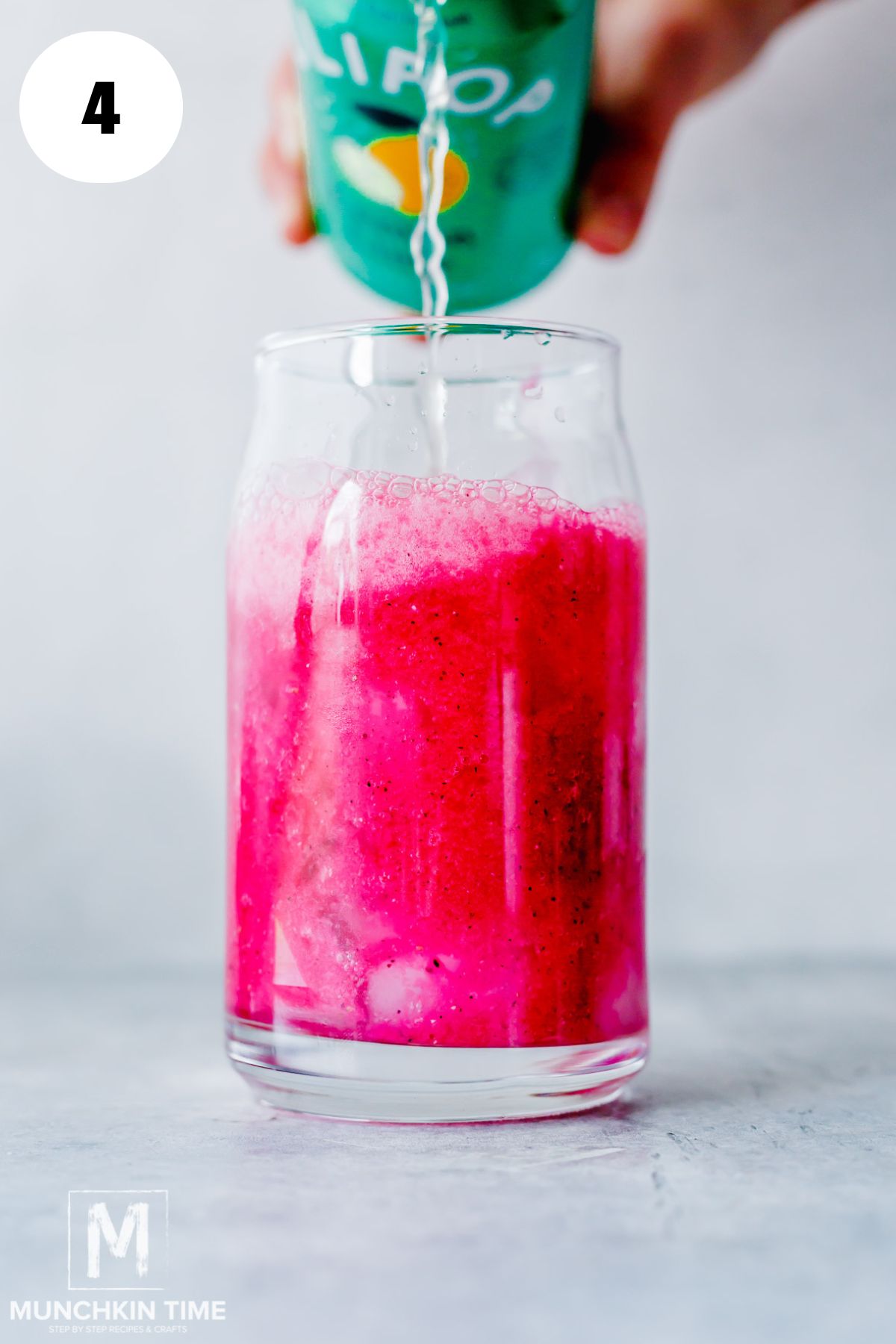 soda added to the tall glass with blended fruit.