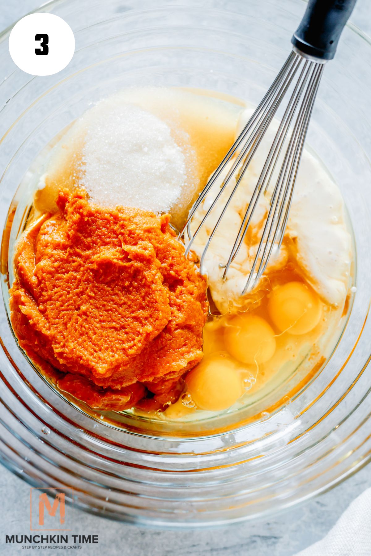 wet ingredients pumpkin puree, eggs, sugar, starter, oil in a bowl.