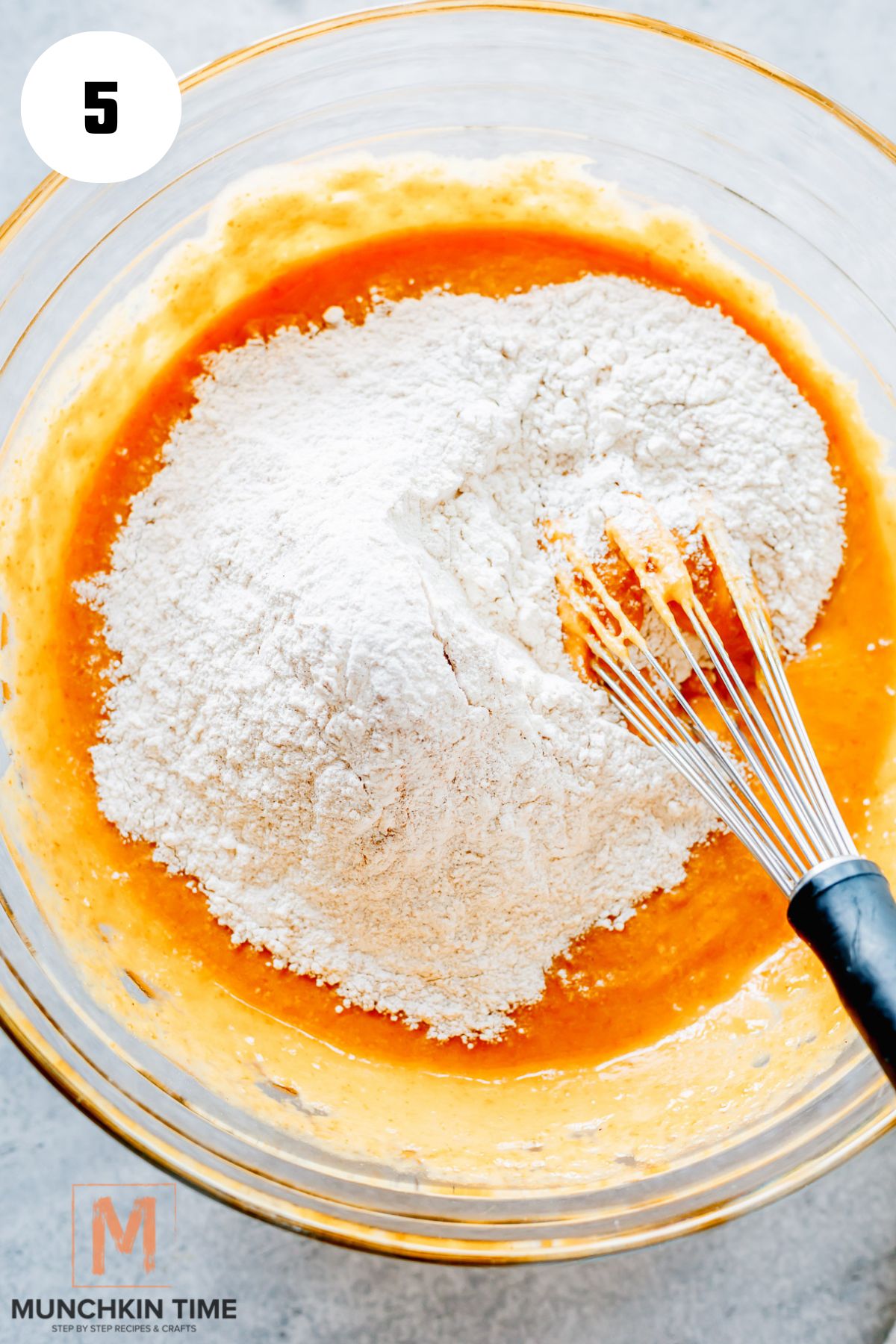 wet ingredients and dry ingredients in a bowl about to get mixed.