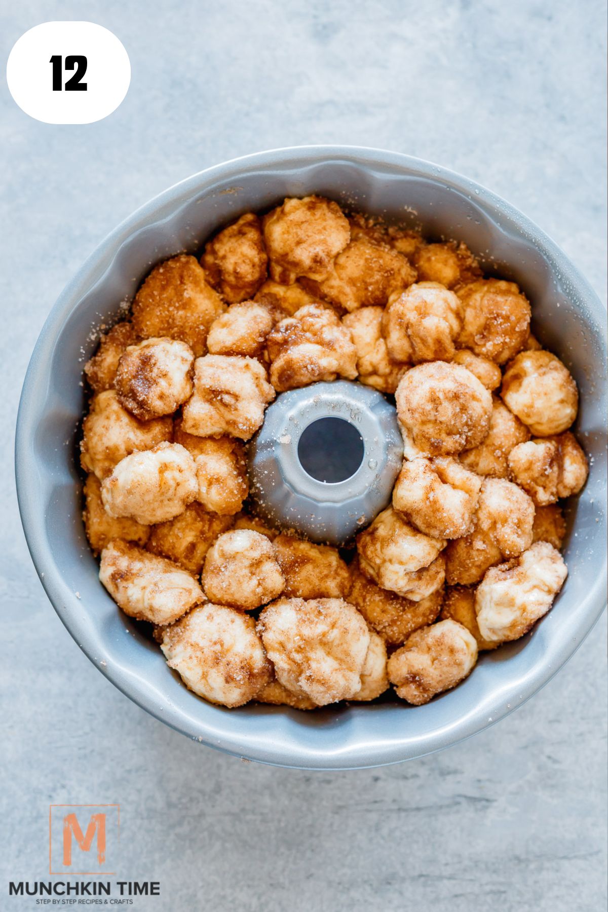 cinnamon dough balls in a pan.