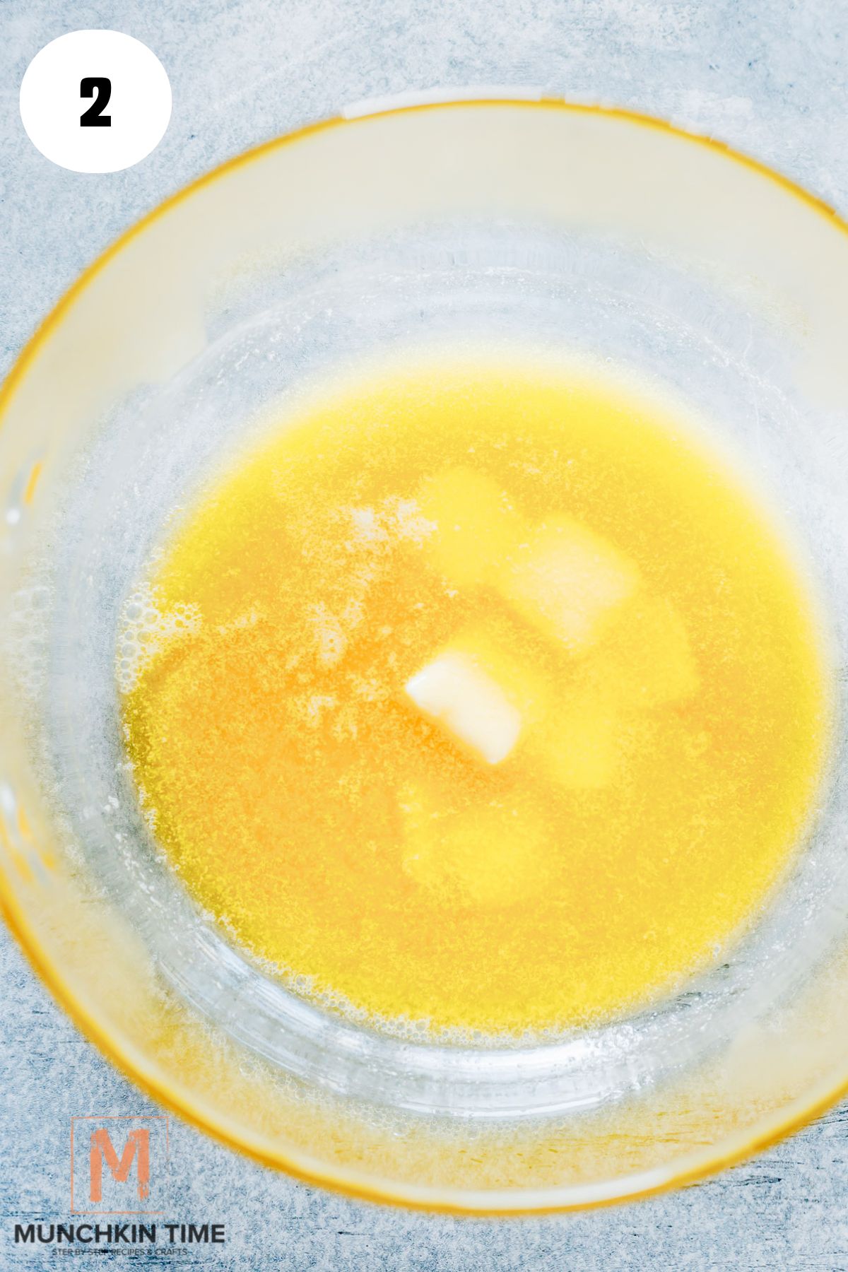 butter melted in a glass pot.