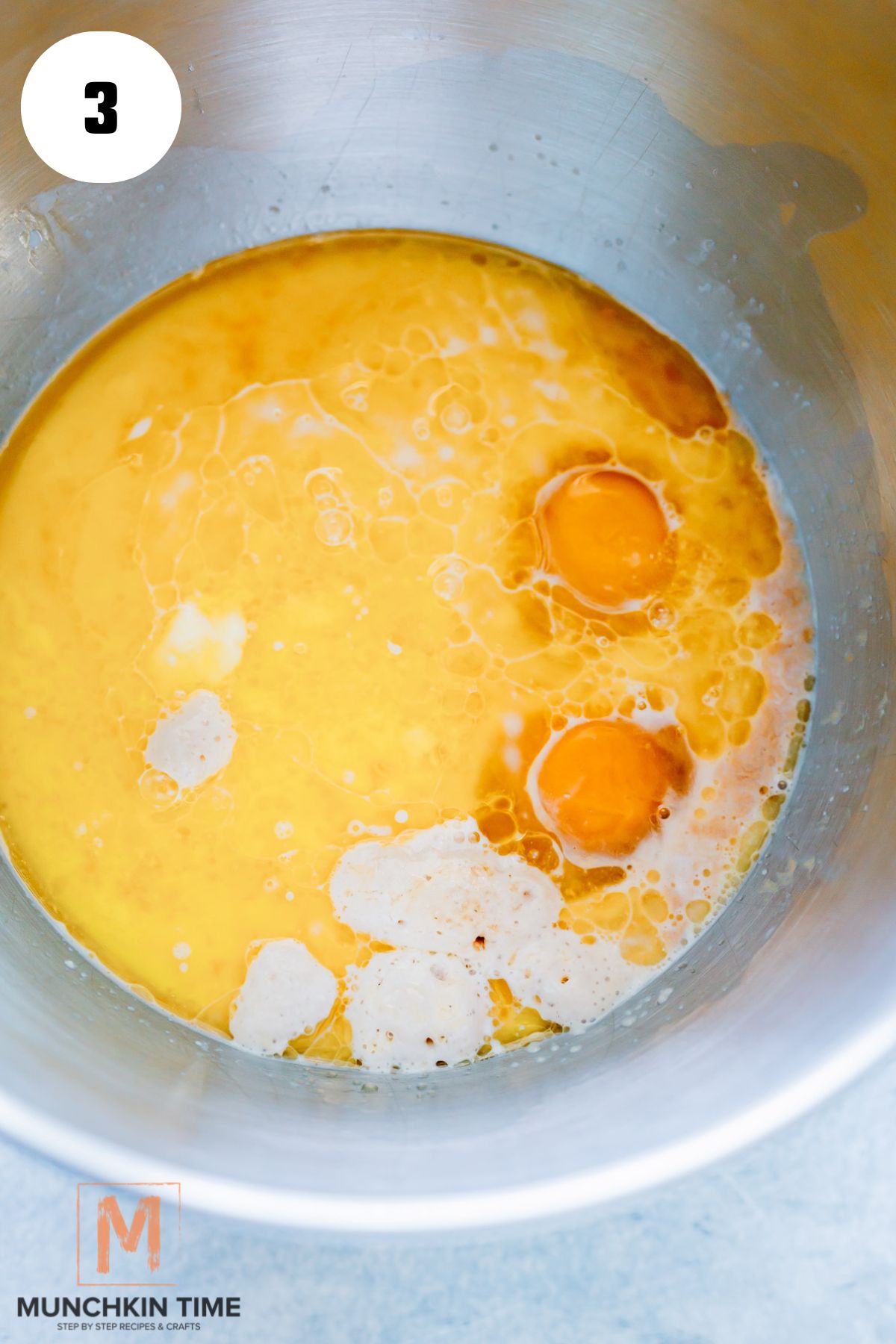 melted butter and egg added to the milk and yeast mixture.