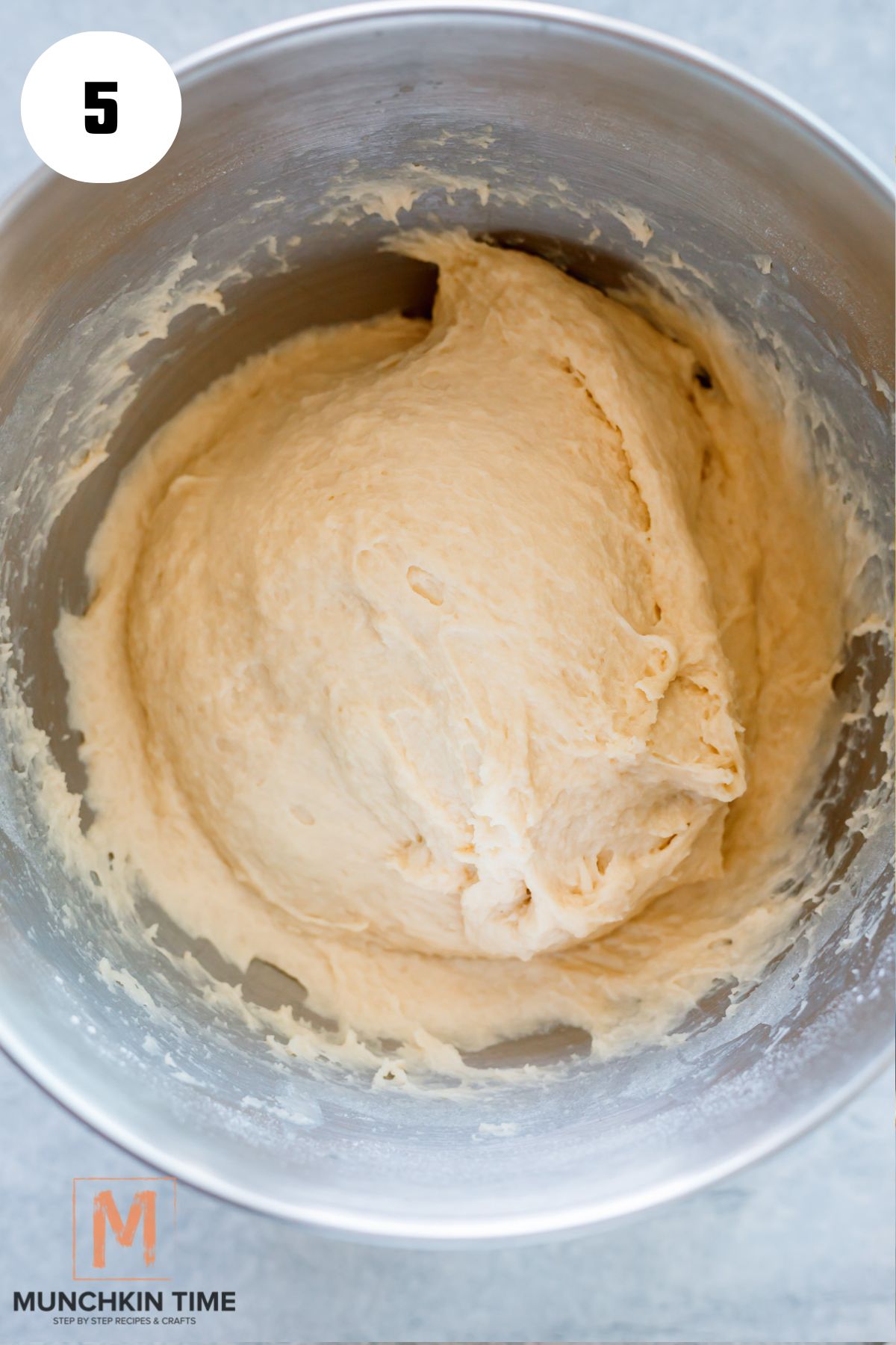 dough done kneading in a stand mixture.