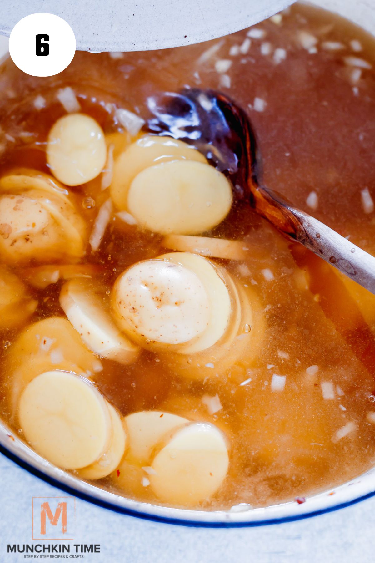 chicken broth water and potatoes added to the pot.