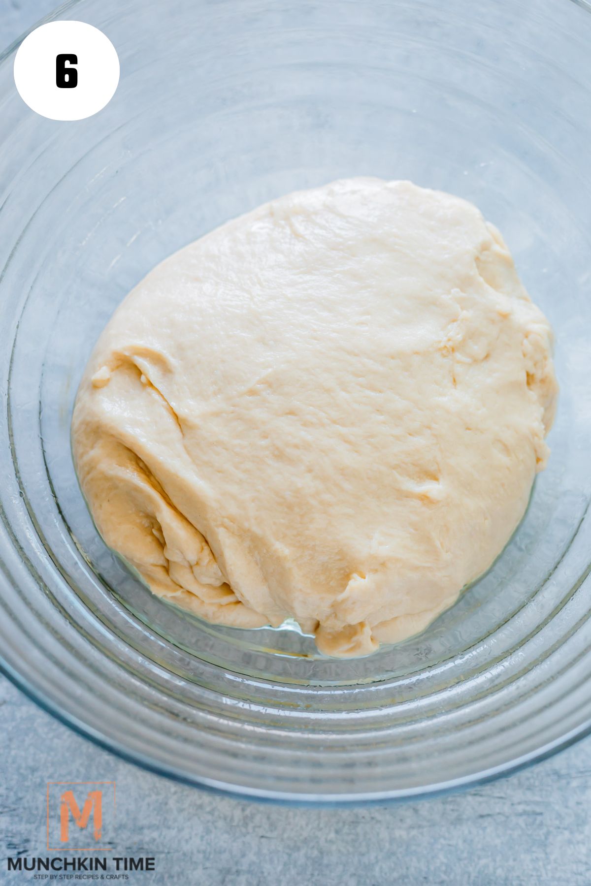 dough placed in a greased bowl.