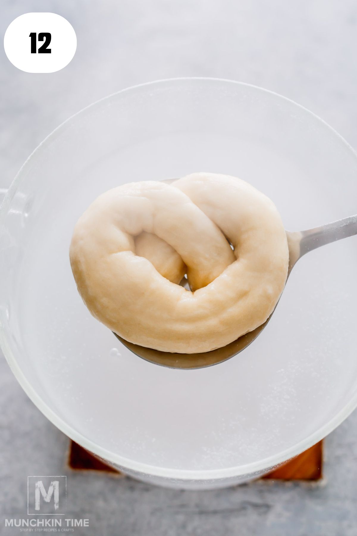 pretzel done cooking in baking water.