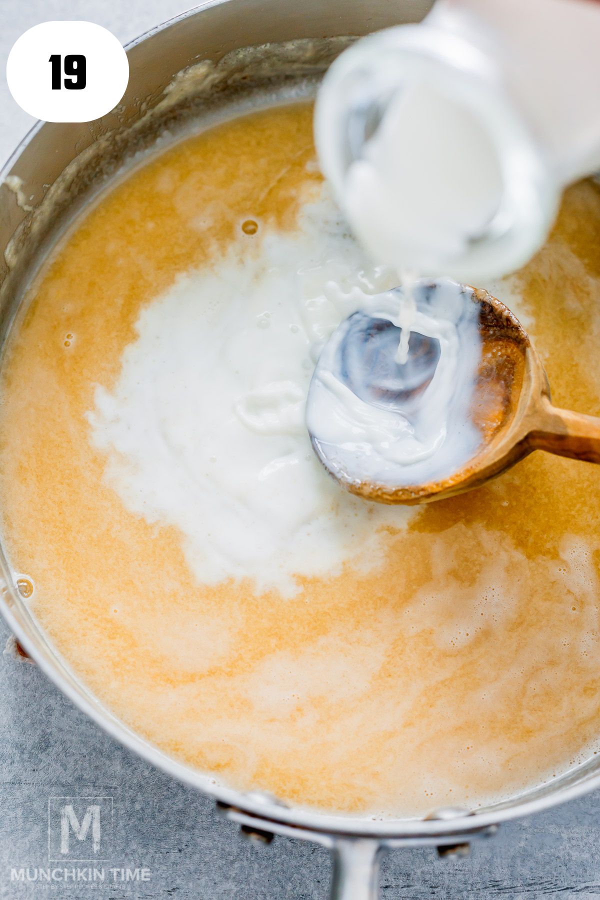 milk pouring into the skillet.