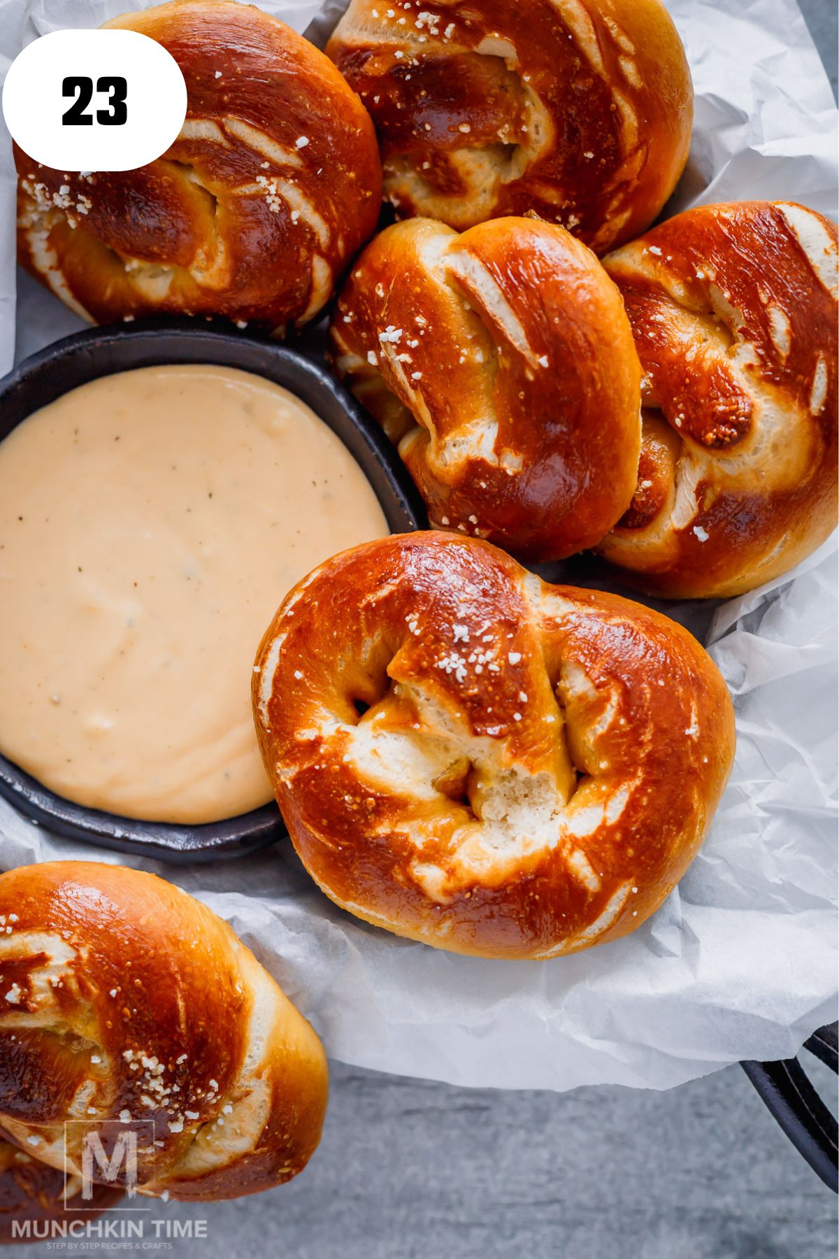 pretzels laying next to the beer cheese dip.