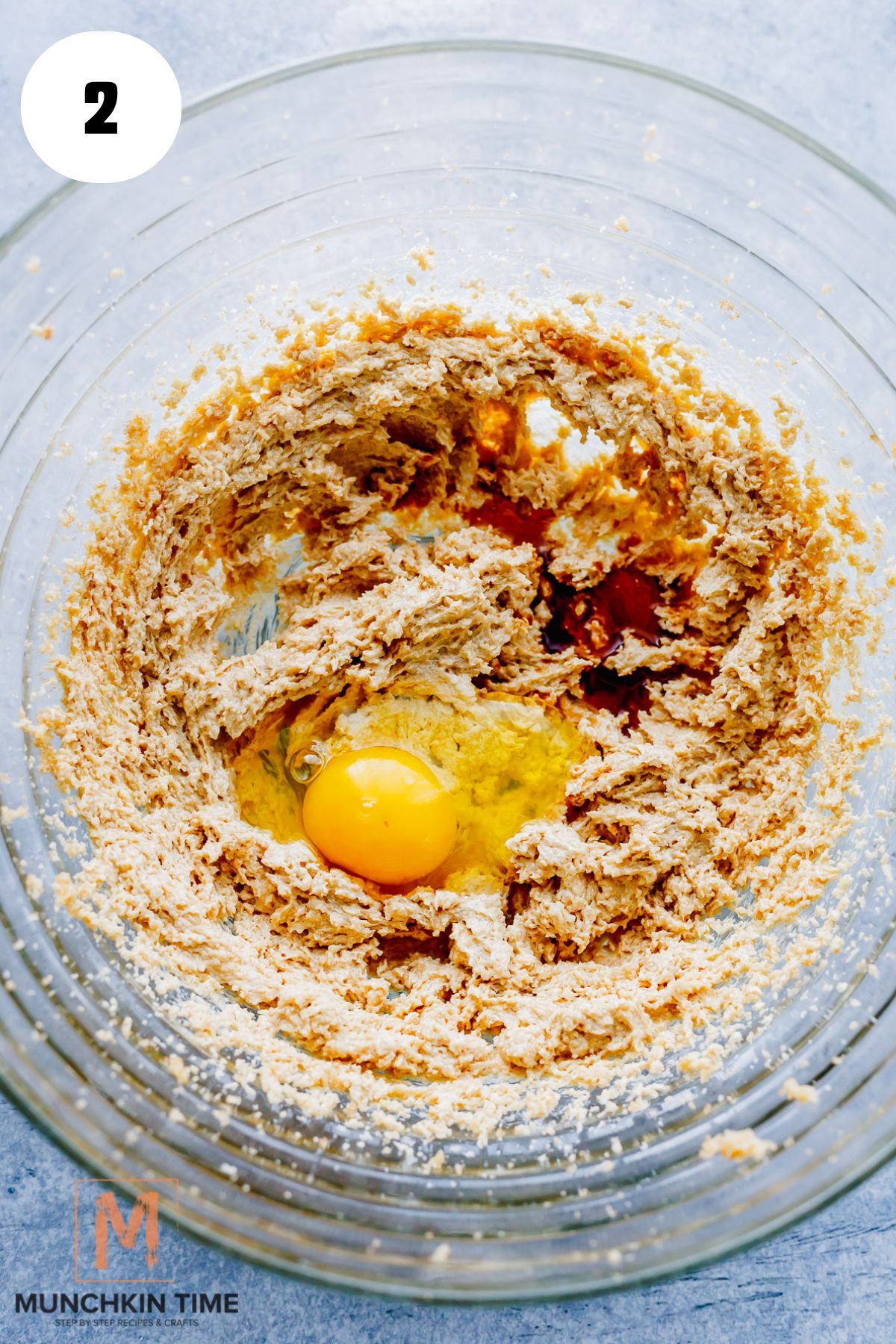 egg added to the mixture of sugar and butter.