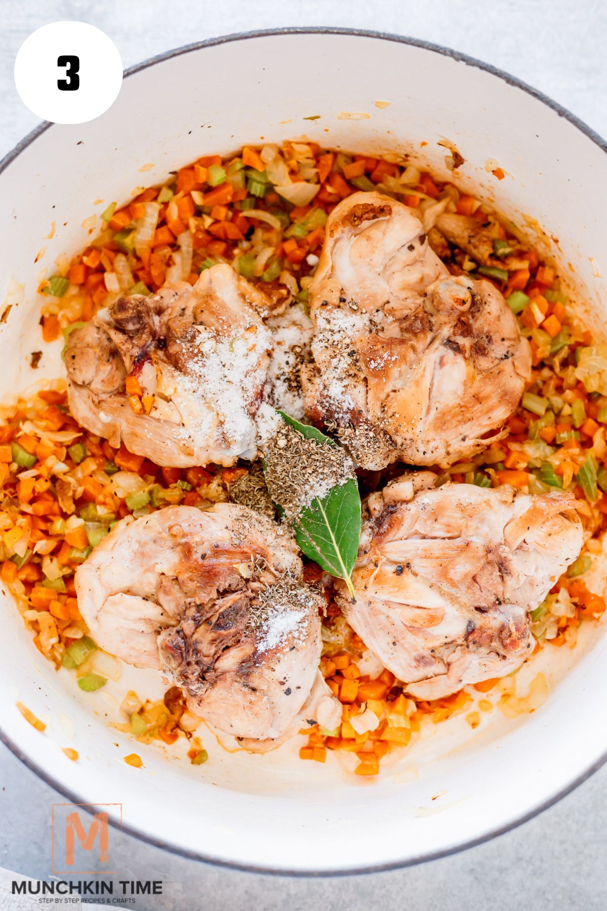 chicken and spices added to the pot.