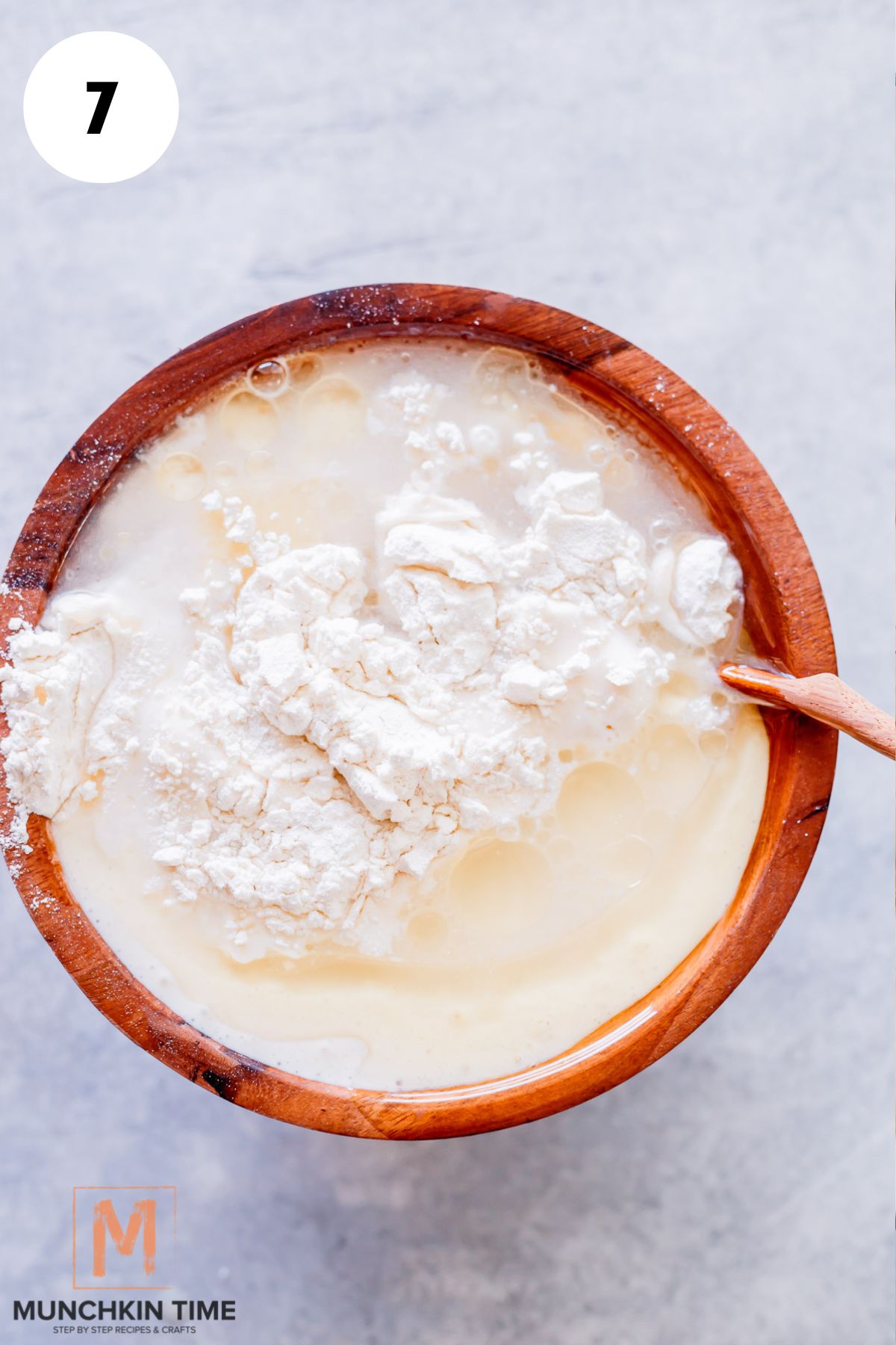 dumpling ingredients added to the wooden bowl.