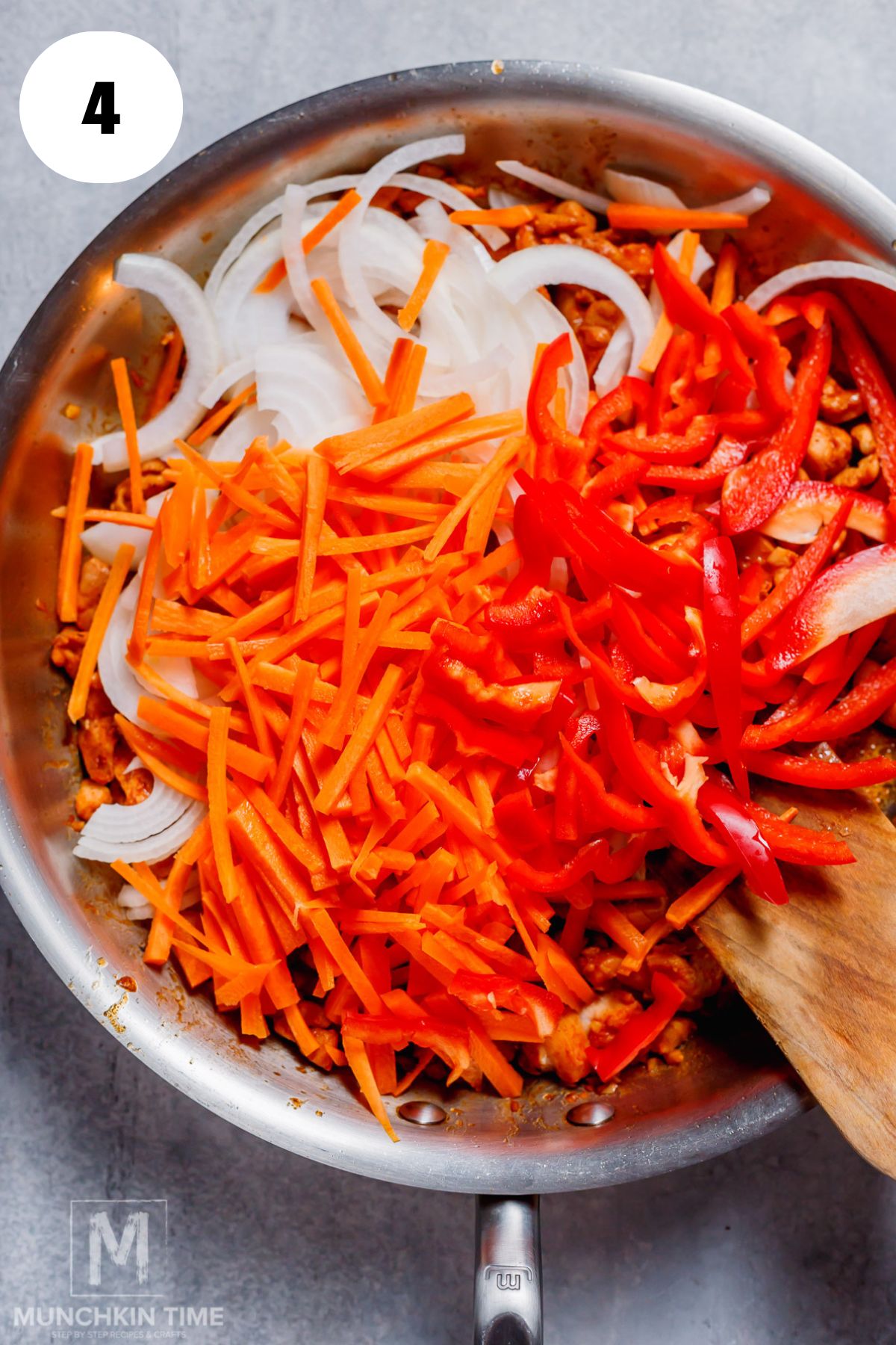 onion carrot and bell pepper added to the skillet.