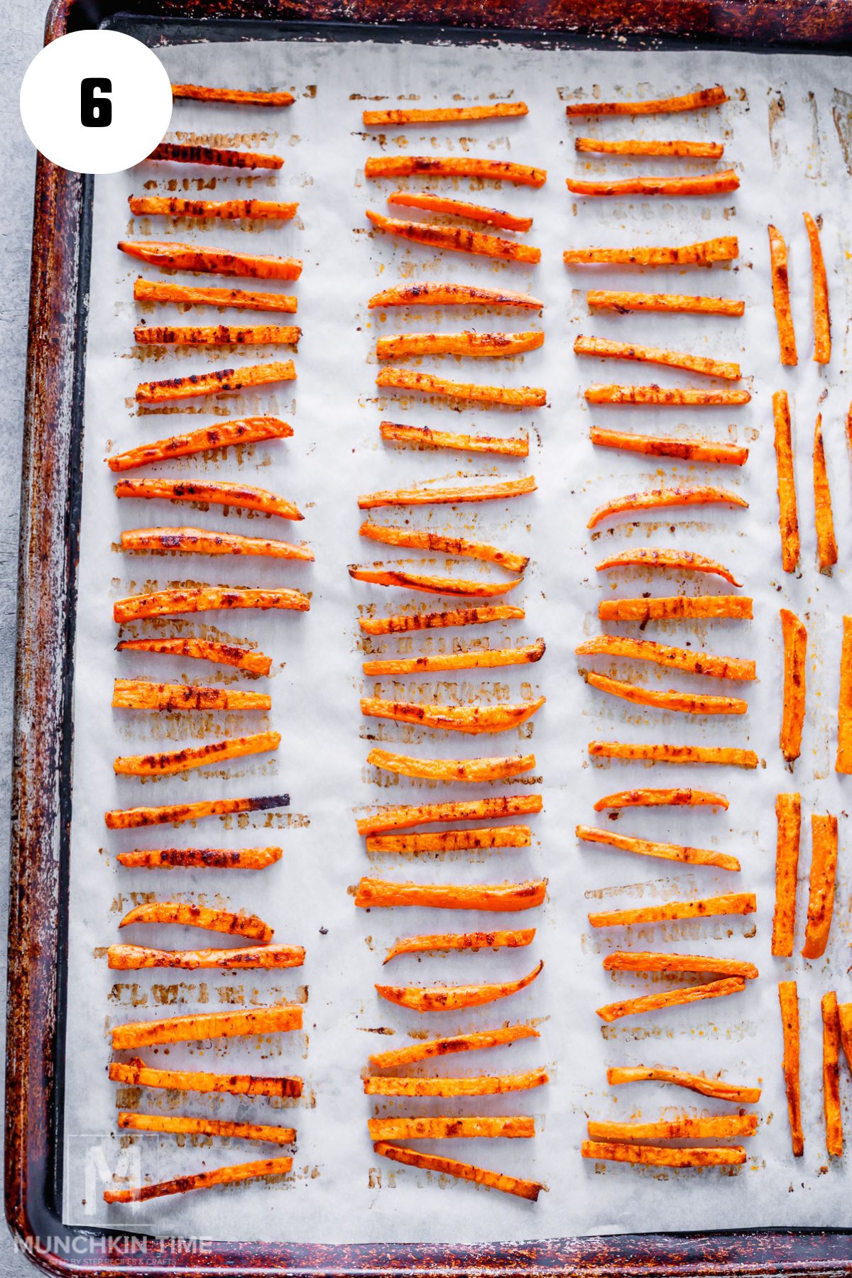 Crispy Oven Baked Sweet Potato Fries on baking sheet done baking.