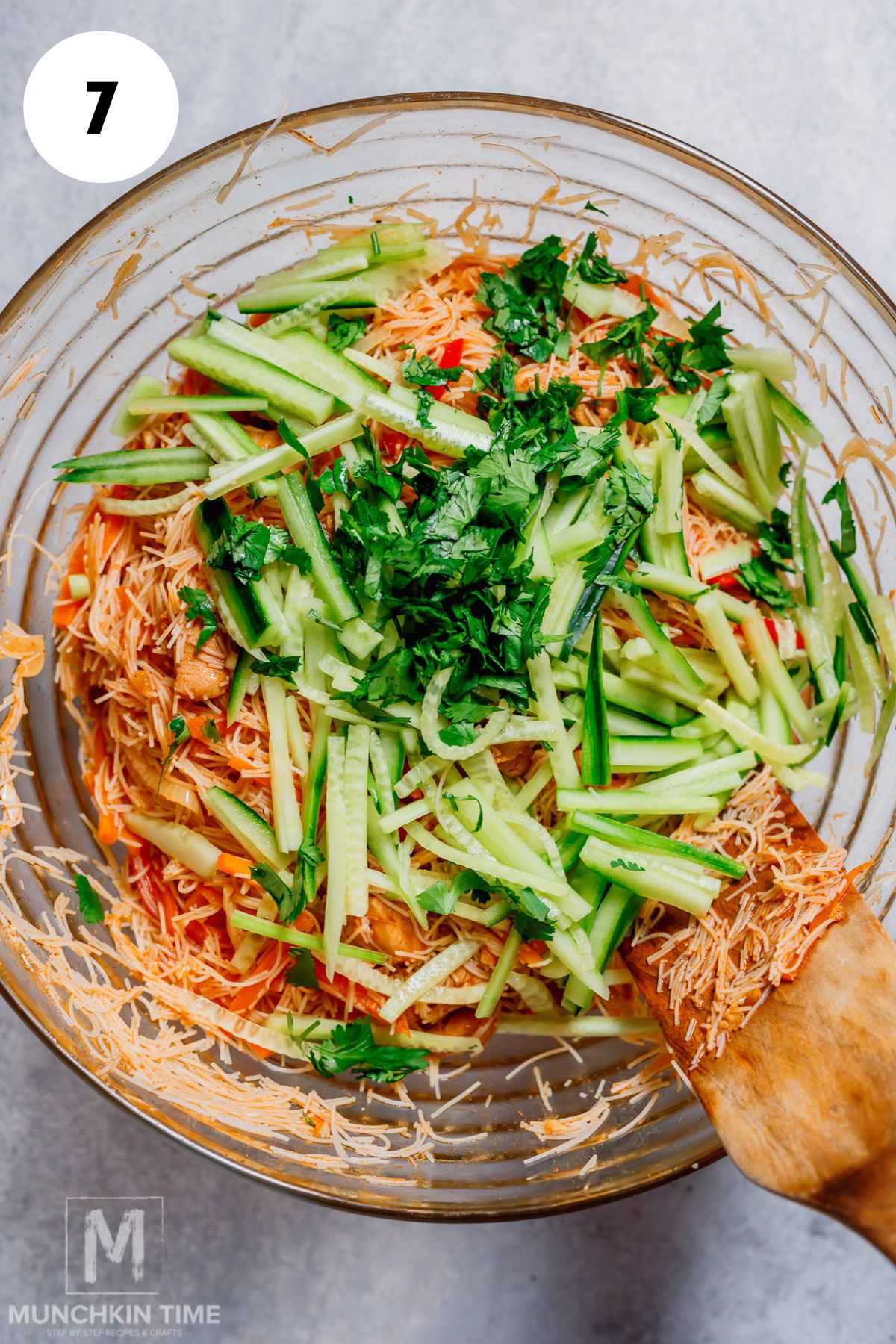 cucumbers and cilantro added to the bowl with stir fry chicken and noodles.