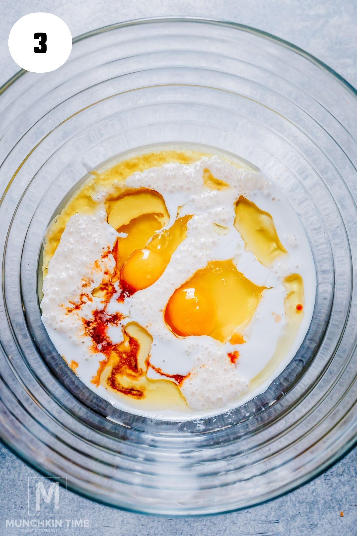 wet ingredients added to the large bowl.