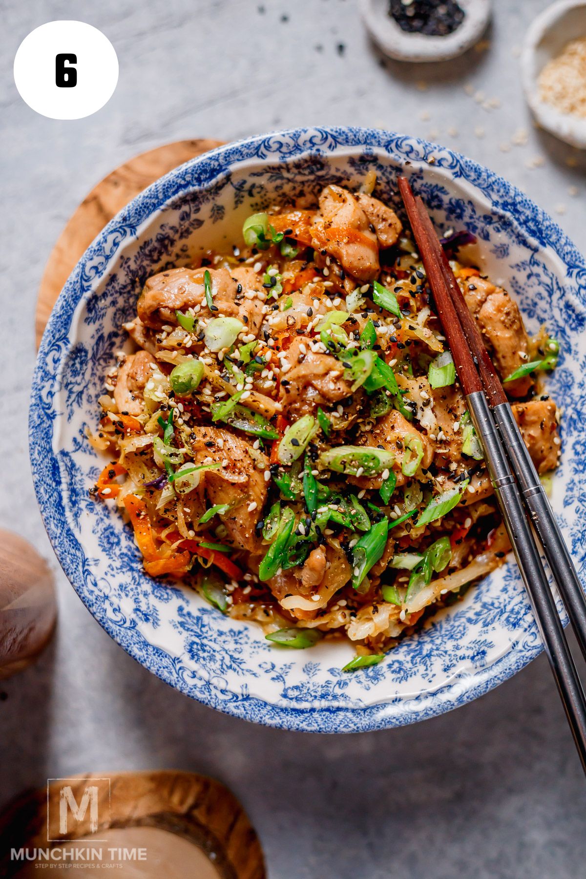 chicken egg roll in a bowl with chop sticks.