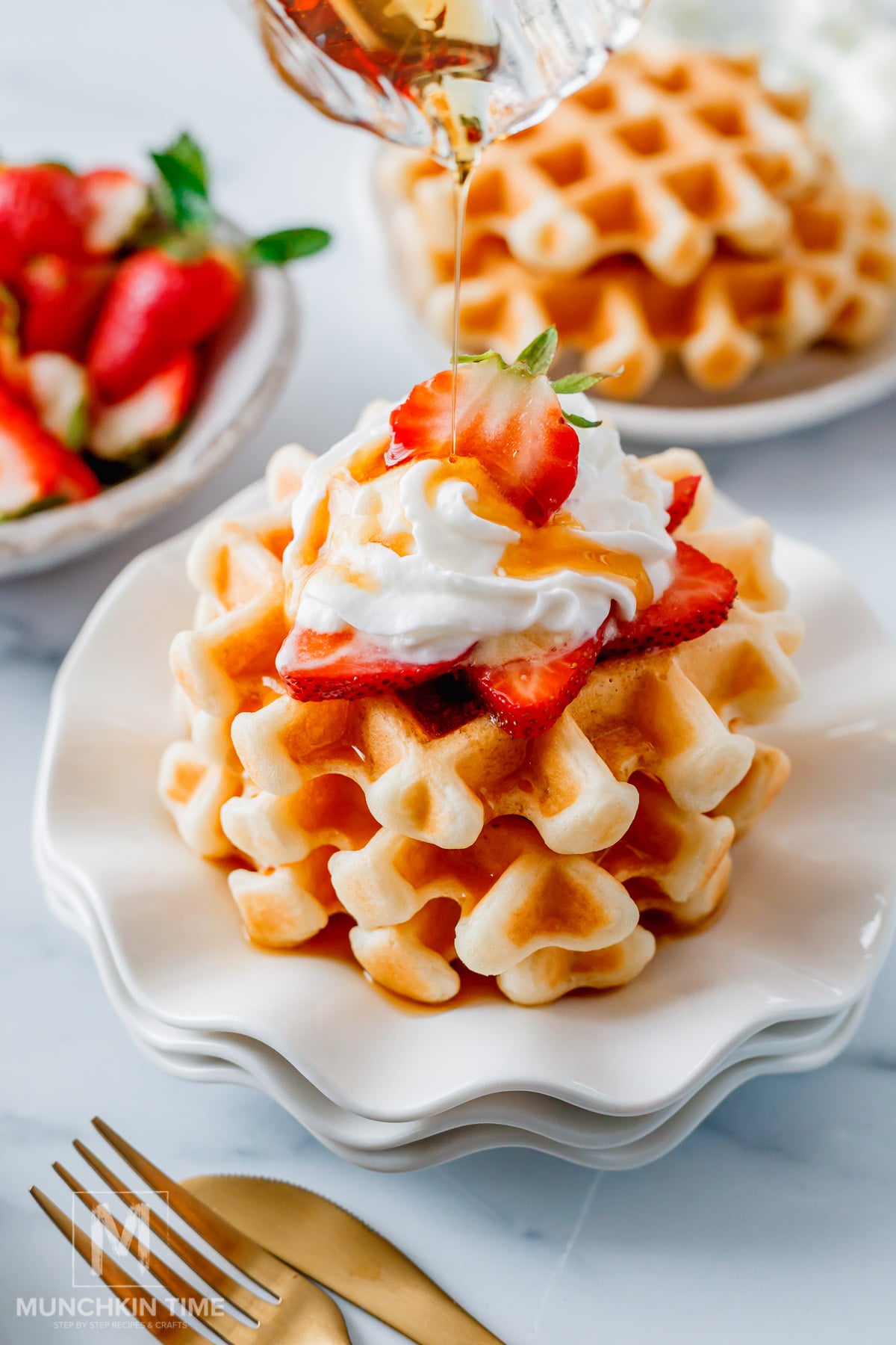 Maple syrup pouring over the Crispy Sourdough Waffles (Easy Discard or Active Starter Recipe)