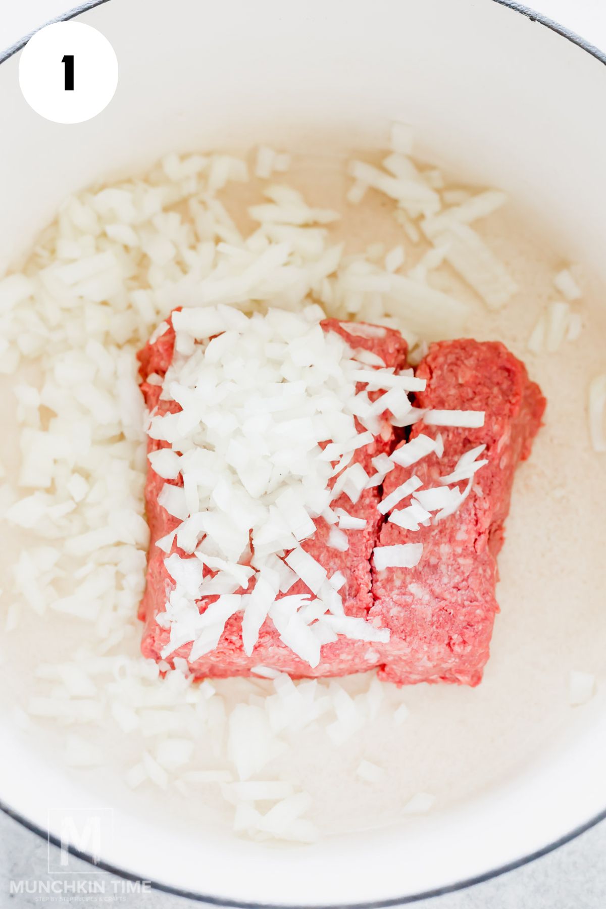 ground beef and onion added to the Dutch oven over medium heat.