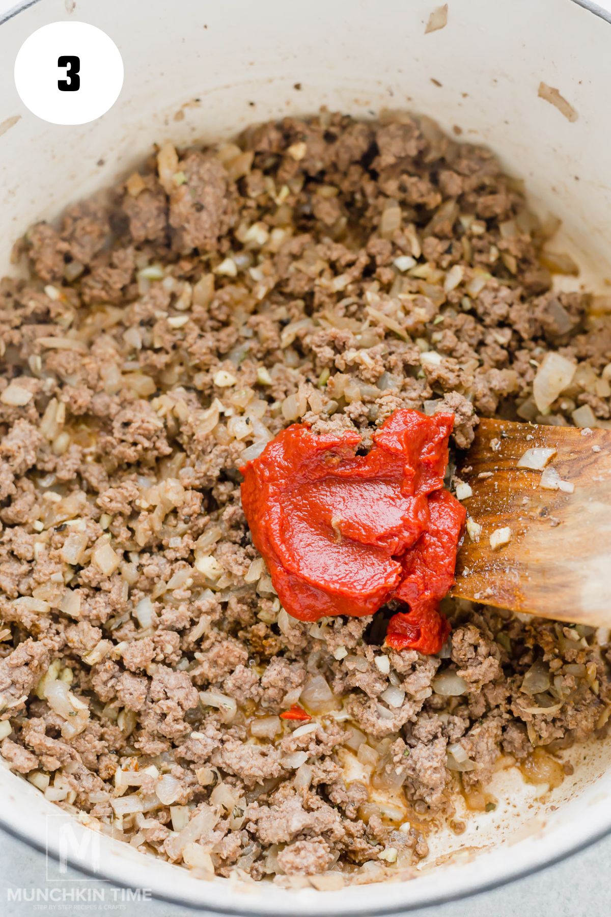 tomato paste added to the cooked beef mixture.