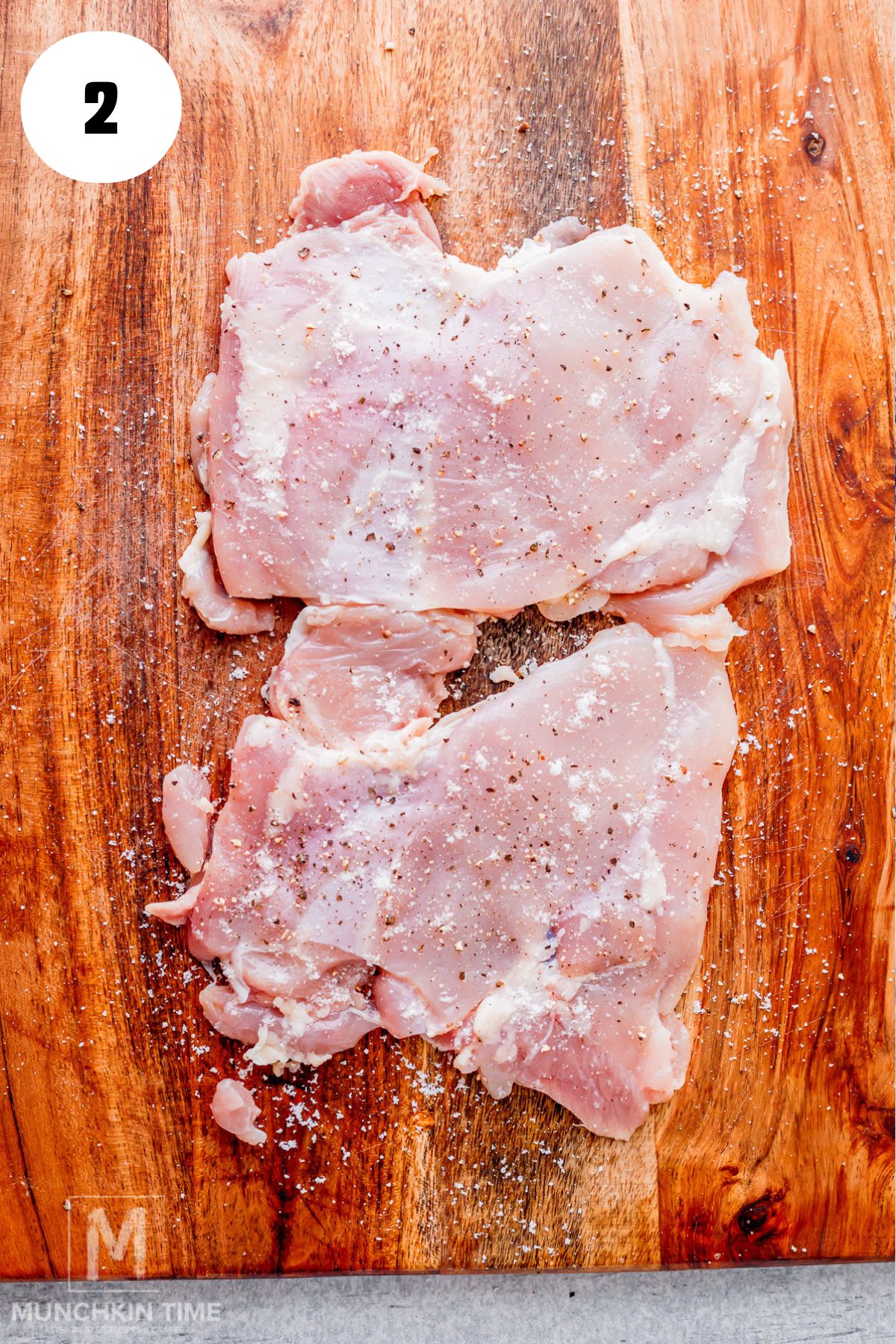 pounded chicken seasoned with salt and pepper.