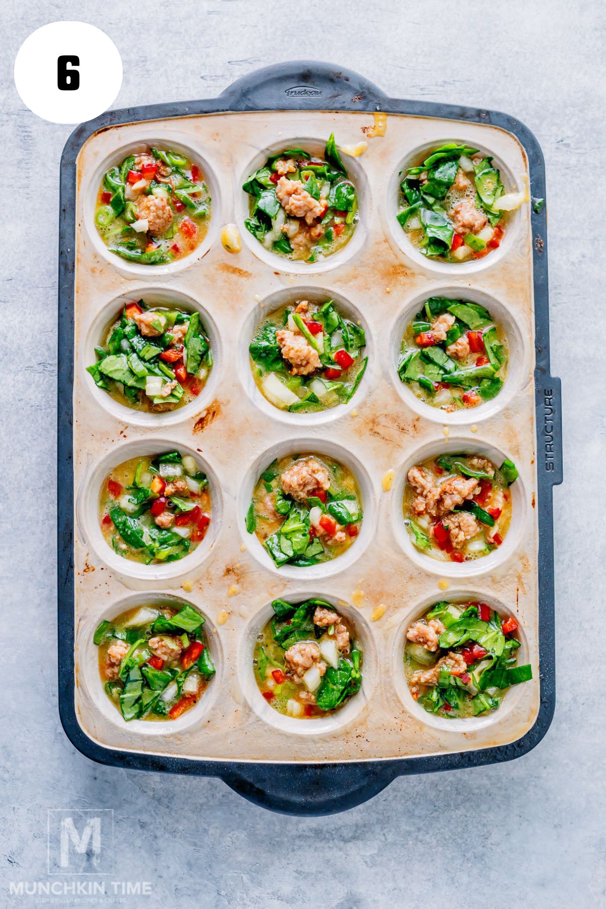 egg mixture divided into 12 muffin cups.