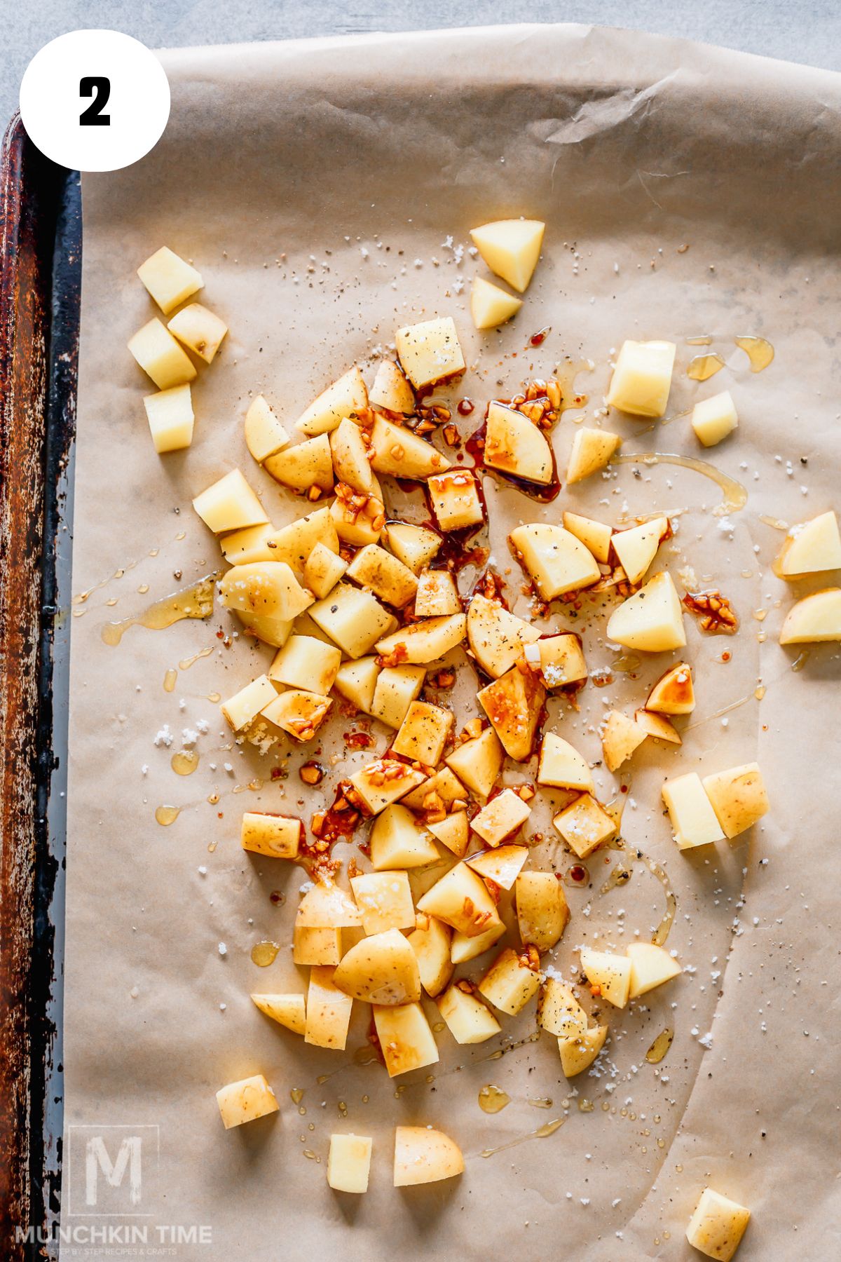 cut potatoes on a baking sheet