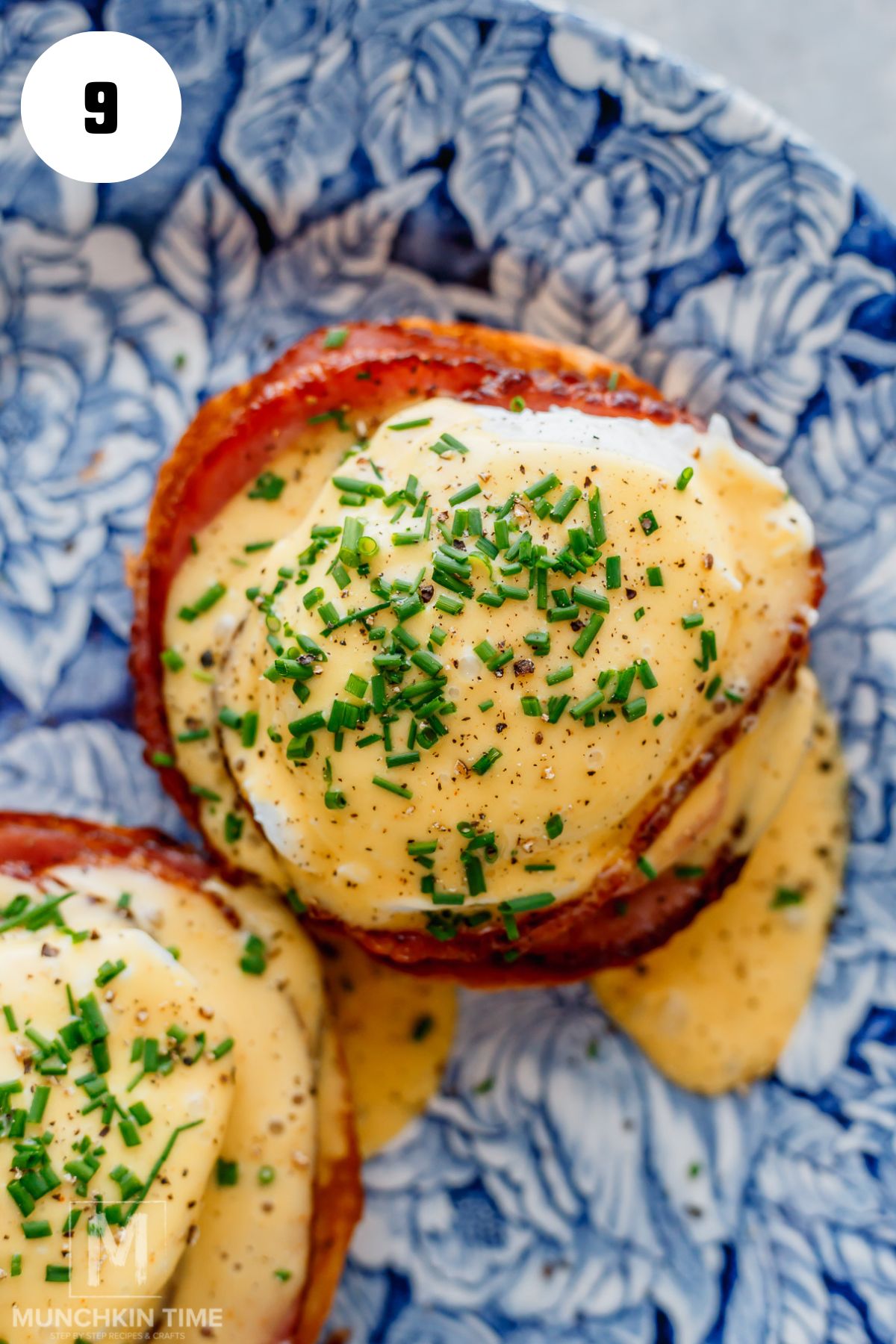 easy eggs benedict garnished with chives and black pepper.