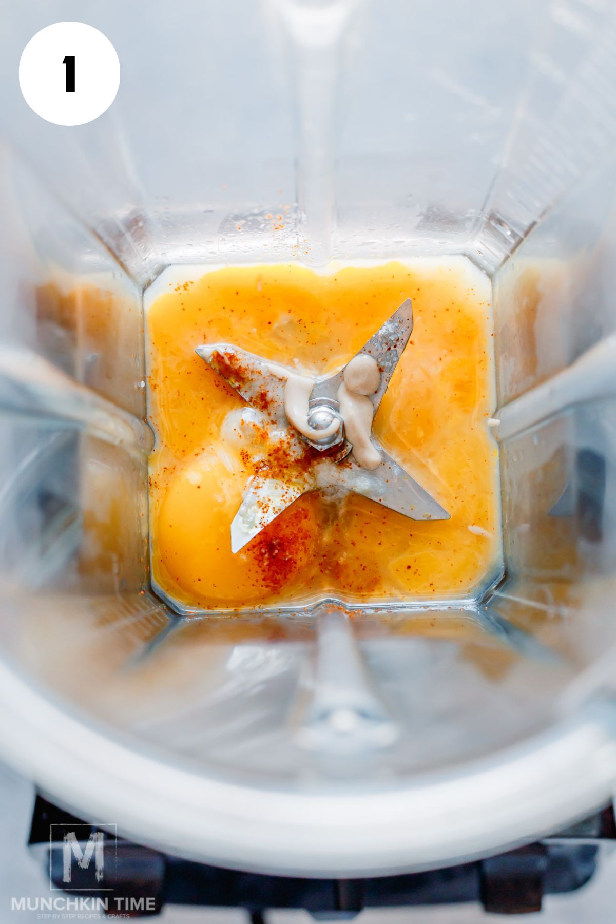 egg yolks, lemon juice, Dijon mustard, salt, and cayenne pepper added to a blender