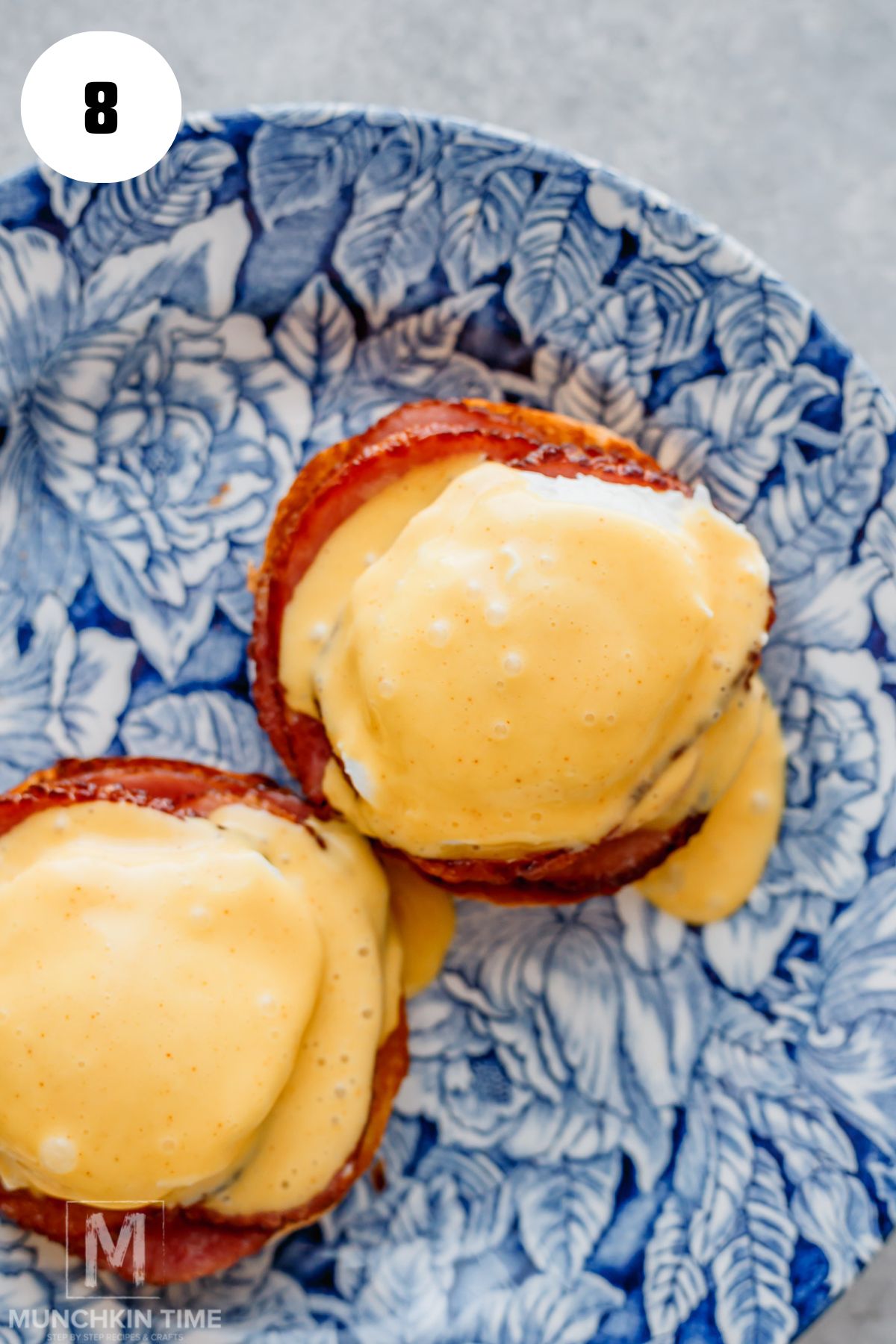 Hollandaise sauce added to the top of Canadian bacon.