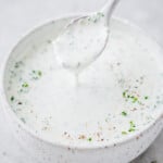 Creamy homemade ranch dressing with fresh herbs served in a small bowl.